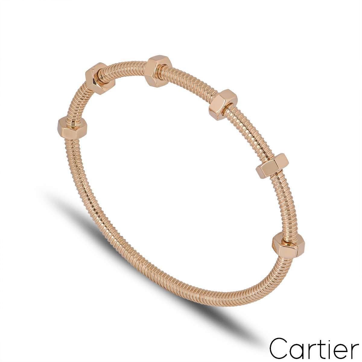An 18k Rose gold bracelet by Cartier from the Ecrou De Cartier collection. The bracelet has a threaded design which features 6 bolts with 4 of them swivelling freely along one side of the bracelet. With a gross weight of 31.9 grams, this bracelet is