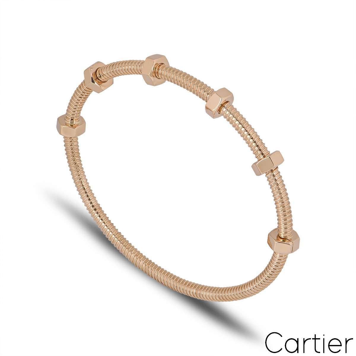 Ein Armband aus 18 Karat Roségold von Cartier aus der Kollektion Ecrou De Cartier. Das Armband hat ein Gewindedesign mit 6 Bolzen, von denen 4 auf einer Seite des Armbands frei schwenkbar sind. Mit einem Bruttogewicht von 31,9 Gramm hat dieses