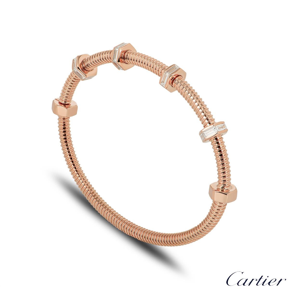 A stunning size 16, 18k Rose gold bracelet by Cartier from the Ecrou De Cartier collection. The bracelet has a threaded design which features 6 bolts with 4 swivelling freely along one side of the bracelet, each set with 6 baguette-cut diamonds