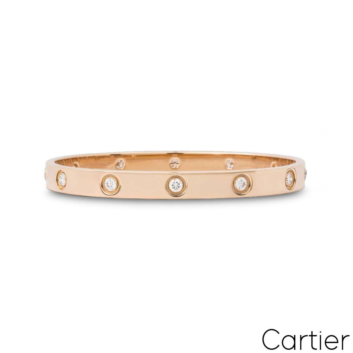 An 18k rose gold full diamond bracelet by Cartier from the Love collection. The bracelet is set with 10 round brilliant cut diamonds circulating the outer edge throughout in a rubover setting totalling 0.96ct. The bangle is a size 16 and features