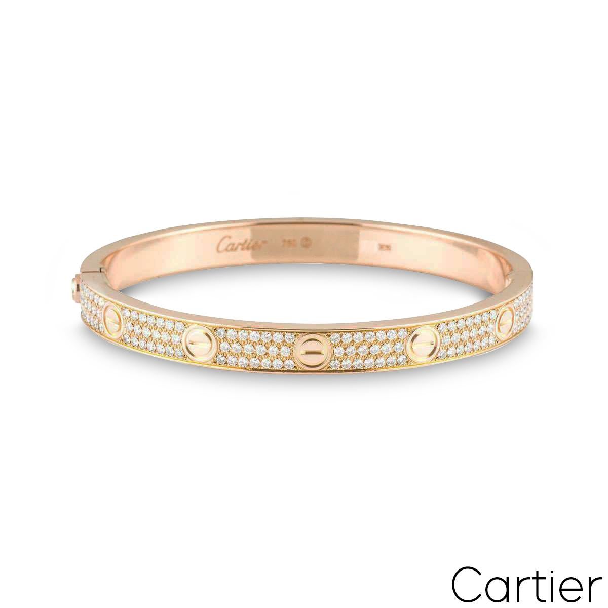 A sparkly 18k rose gold diamond Cartier bracelet from the Love collection. The bracelet comprises of the iconic screw motif on the outer edge complemented with 204 round brilliant cut diamonds throughout, in a pave setting. The diamonds have an
