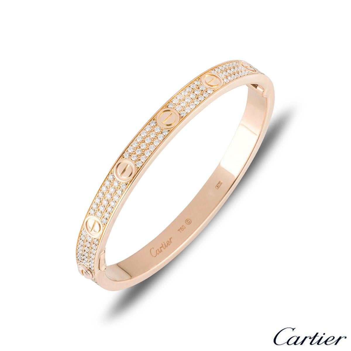 A sparkly 18k rose gold diamond Cartier bracelet from the Love collection. The bracelet comprises of the iconic screw motif on the outer edge complemented with 204 round brilliant cut diamonds throughout, in a pave setting. The diamonds have a total