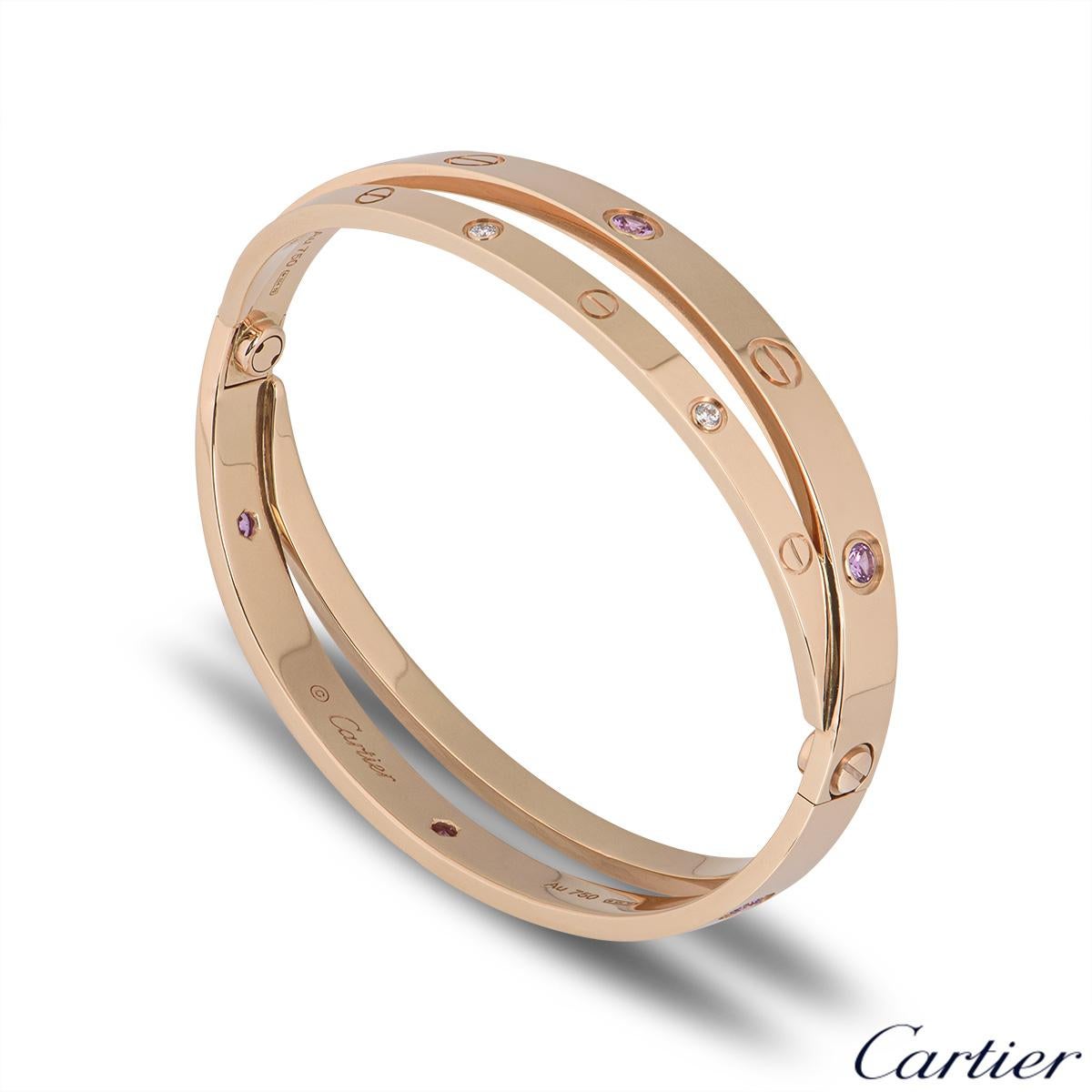 An unworn iconic 18k rose gold half diamond and pink sapphire double Cartier bracelet from the Love collection. The double bangle features the iconic screw motif alternating with 6 round brilliant cut diamonds and 6 pink sapphires displayed around