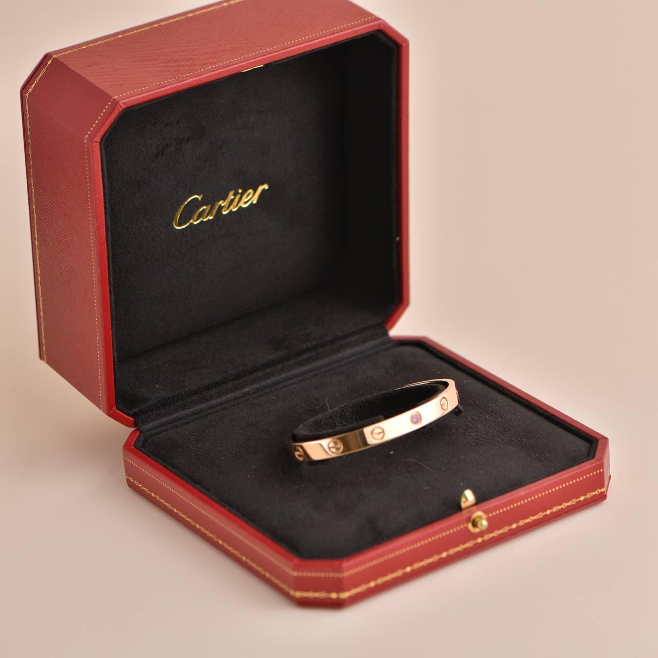 SKU: AT-1722
Brand:  Cartier
Model:  B6030017
Date:  Approx. 2011
Serial No. RI****
_____________________________________________________________
Size 17
Metal:  18K Rose Gold
Stone:  1