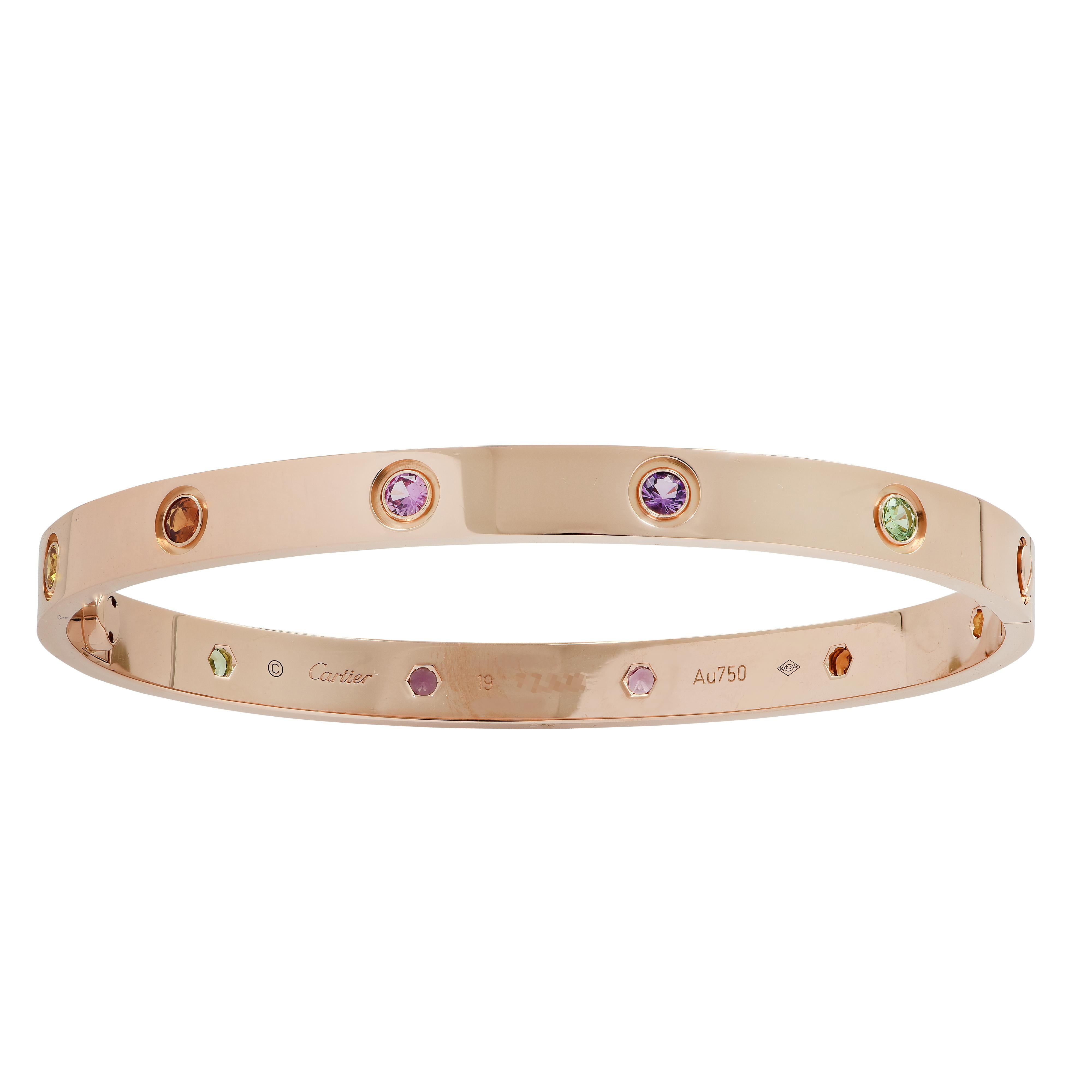 Cartier LOVE bangle crafted in 18 Karat Rose Gold, featuring 2 green garnets, 2 purple amethysts, 2 rose sapphires, 2 orange garnets and  2 yellow sapphires. The Cartier love collection is a timeless tribute to the symbol of love that transcends