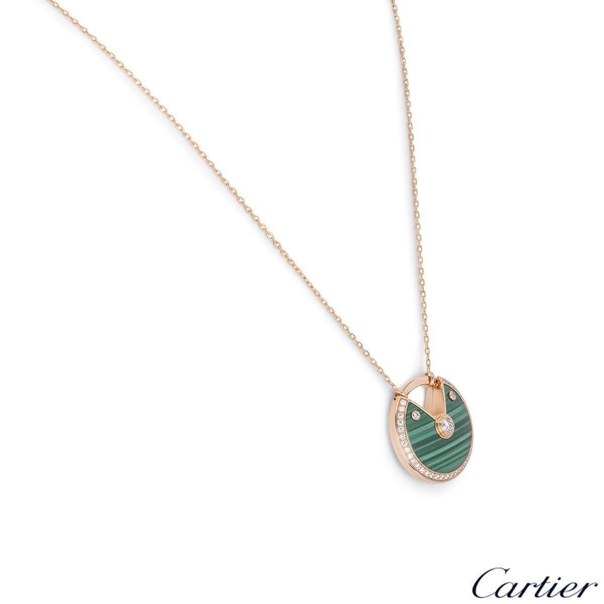 A beautiful 18k rose gold large size necklace from the Amulette de Cartier collection. The necklace comprises of a circular talisman set with malachite, complemented by round brilliant cut diamonds totalling approximately 0.61ct. The talisman is on