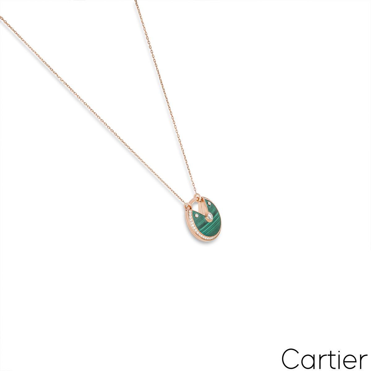 A beautiful 18k rose gold malachite and diamond necklace from the Amulette de Cartier collection. The large pendant comprises of a circular talisman set with malachite, complemented by 39 round brilliant cut diamonds totalling approximately 0.58ct,