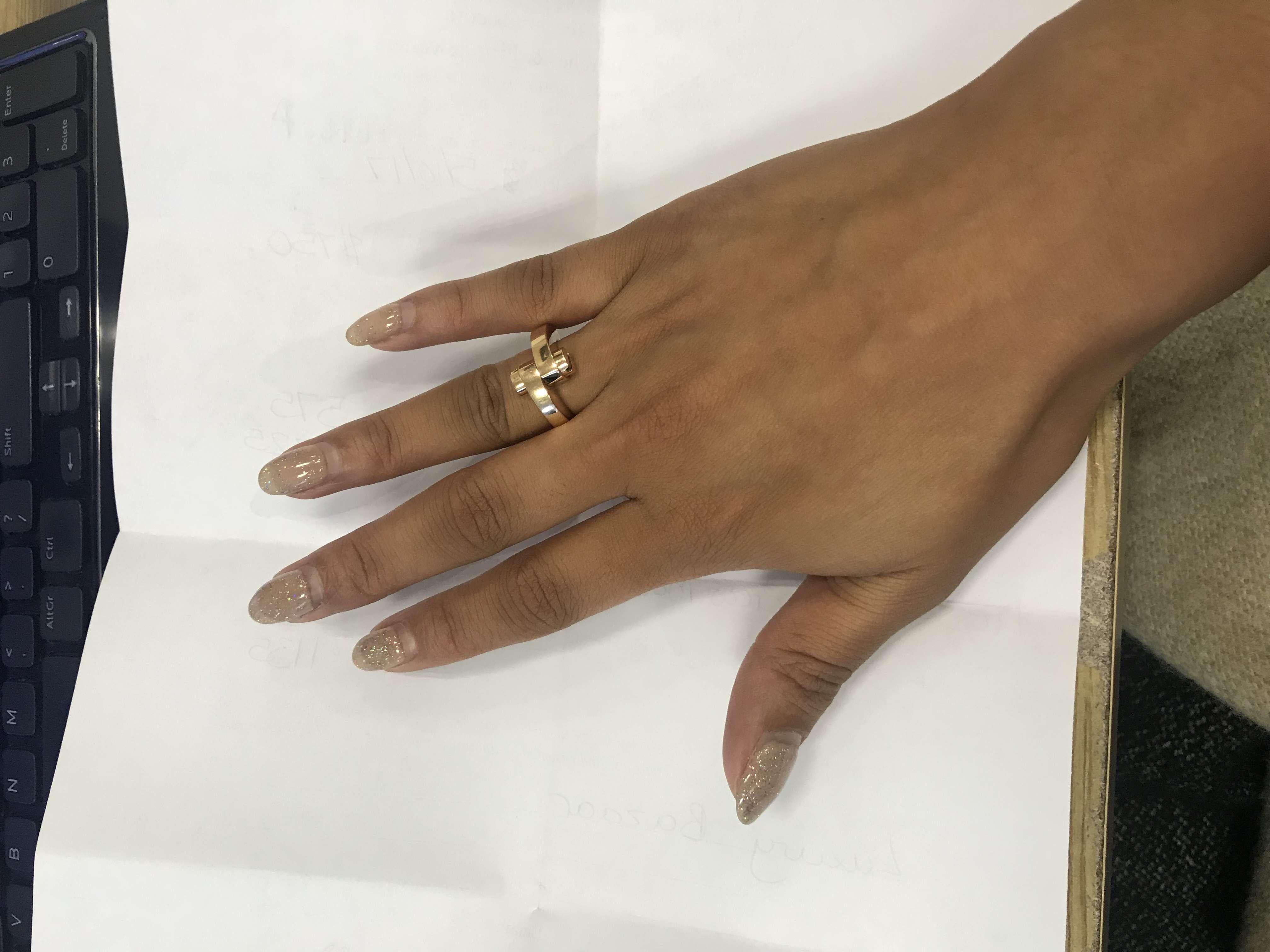 A trendy 18k rose gold Cartier ring from the Menotte collection. The ring comprises of the iconic motif with two screw motif terminations. The ring is a size UK I/US 4/EU 47.5 and has a gross weight of 13.10 grams.

The ring comes complete with a