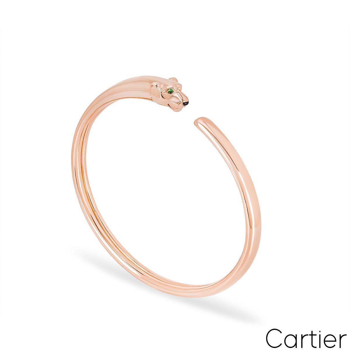 A striking 18k rose gold bracelet by Cartier from the Panthere de Cartier collection. The bracelet comprises of a panther head motif set with 2 round tsavorites as eyes and an onyx nose. This bracelet is size 16 and has a gross weight of 24.04