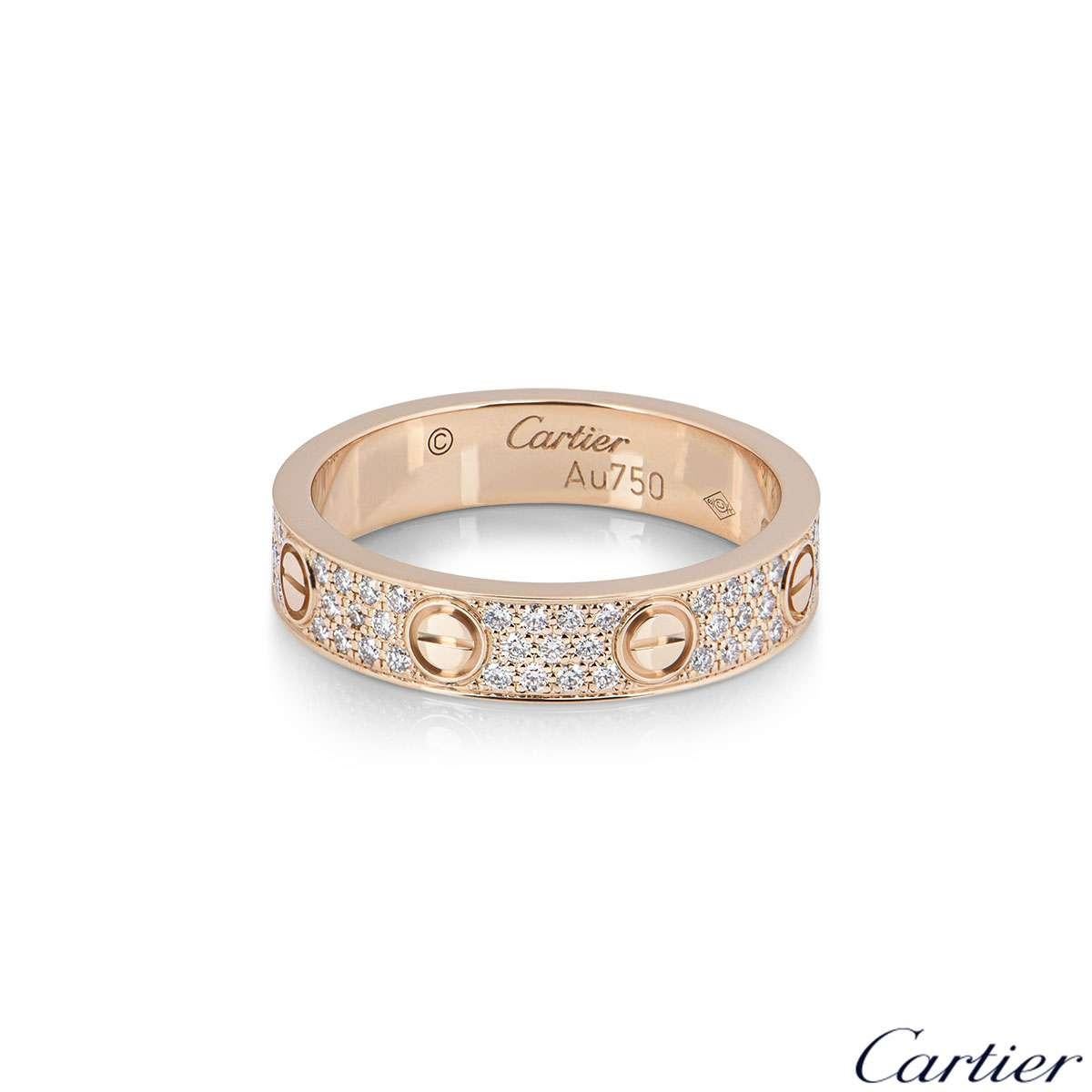 An 18k rose gold Cartier diamond pave ring from the Love collection B4085800. The ring comprises of the iconic screw motifs displayed around the outer edges with 88 round brilliant cut diamonds totalling 0.31ct set between each screw motif. The ring