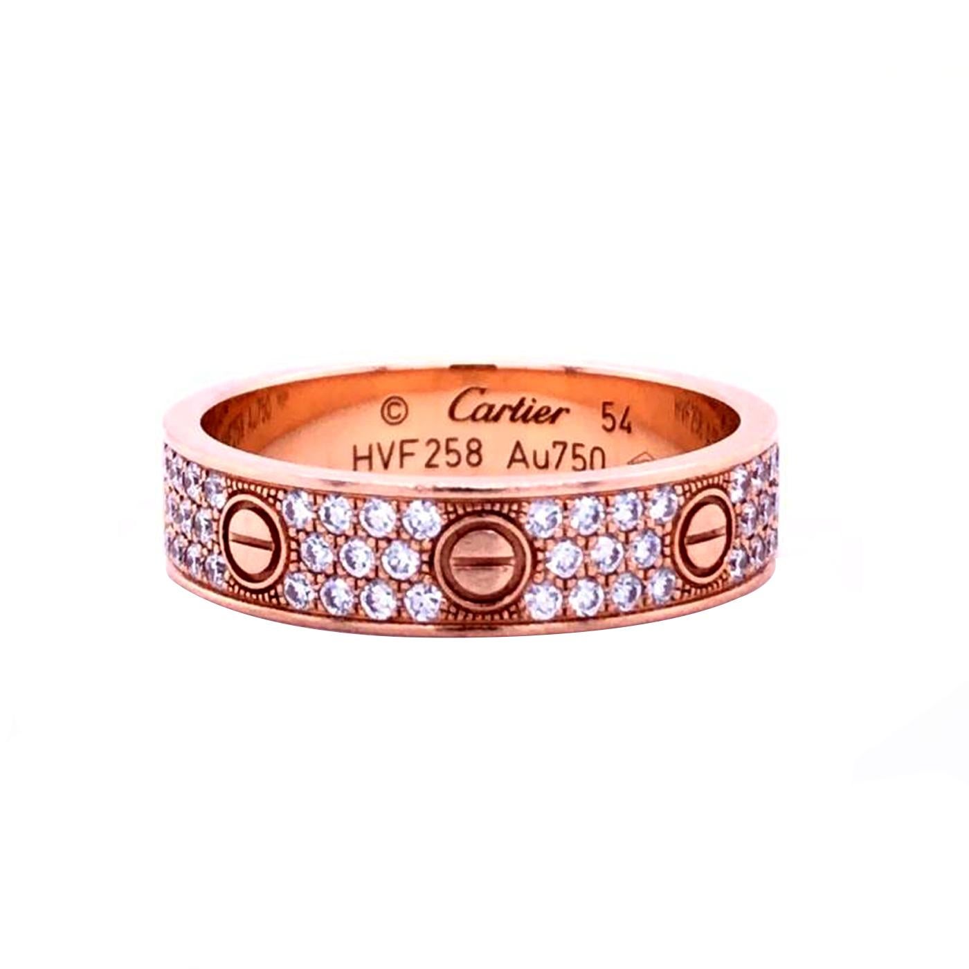 An 18k Rose gold Cartier diamond pave ring from the Love collection. The ring comprises of the iconic screw motifs displayed around the outer edges with 88 round brilliant cut diamonds totalling 0.31ct set between each screw motif. The ring measures