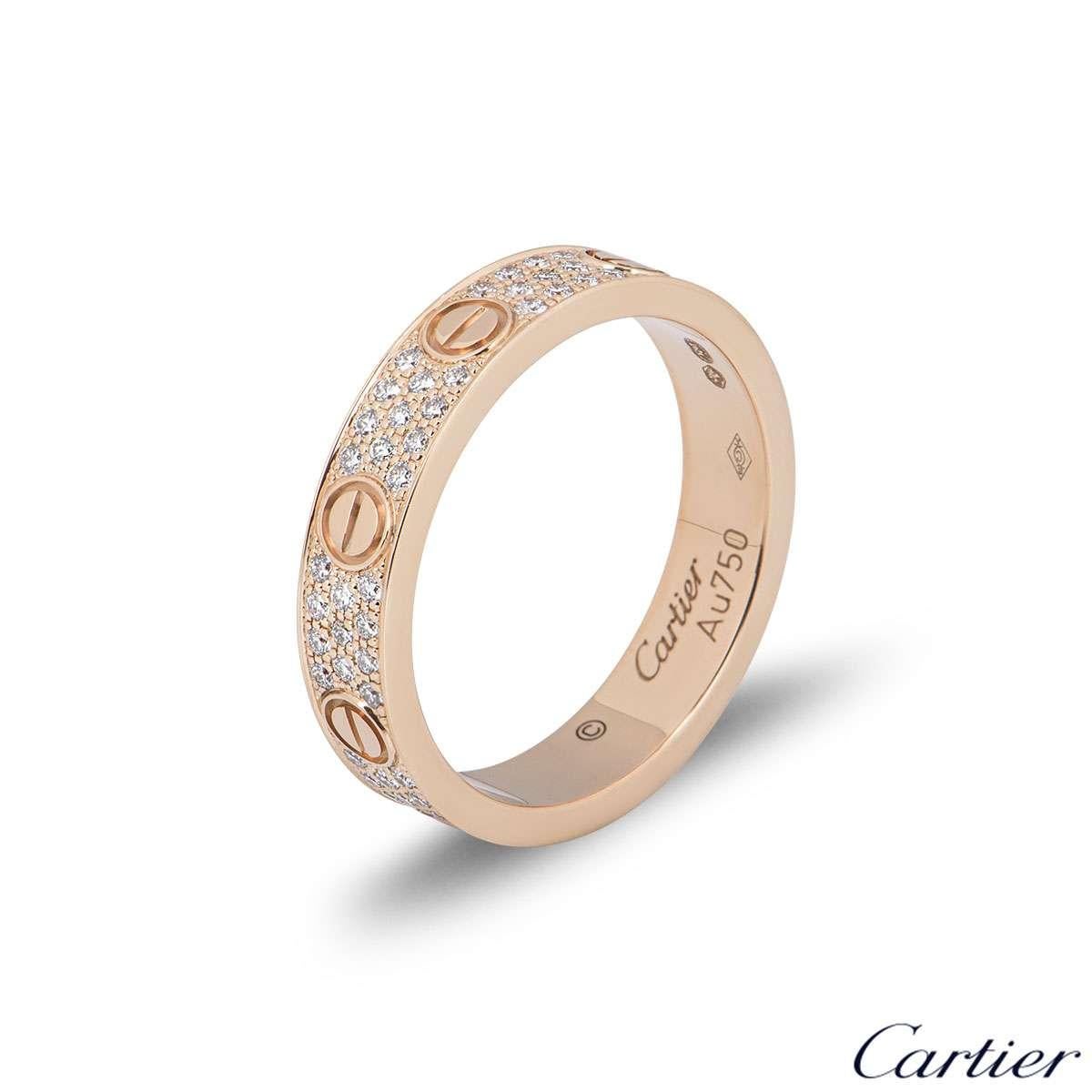 An 18k rose gold Cartier diamond pave ring from the Love collection. The ring comprises of the iconic screw motifs displayed around the outer edges with 88 round brilliant cut diamonds totalling 0.31ct set between each screw motif. The ring measures
