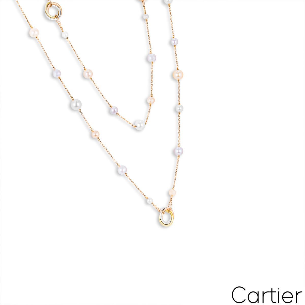 A beautiful 18k rose gold pearl necklace by Cartier from the Trinity de Cartier collection. The necklace is composed of 5 stations of three tri-colour gold intertwining circular motifs. Between each Trinity motif are 7 pearls evenly spaced