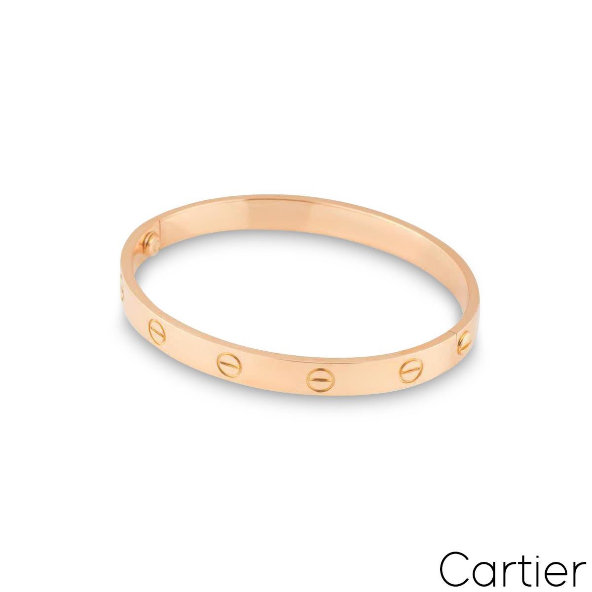 A signature 18k rose gold Cartier plain bracelet from the Love collection. The bracelet has the iconic screw motif displayed around the outer side of the bangle and has the old style screw fitting. The bracelet is a size 16 and has a gross weight of
