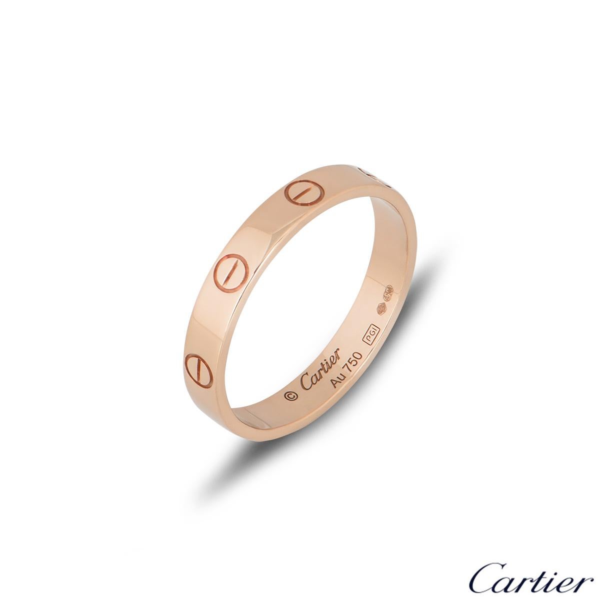 An 18k rose gold Cartier wedding band ring from the Love collection. The ring comprises of the iconic screw motifs on the outer edge of the band. The 3.5mm ring is a size 53 and has a gross weight of 3.20 grams.

The ring comes complete with a