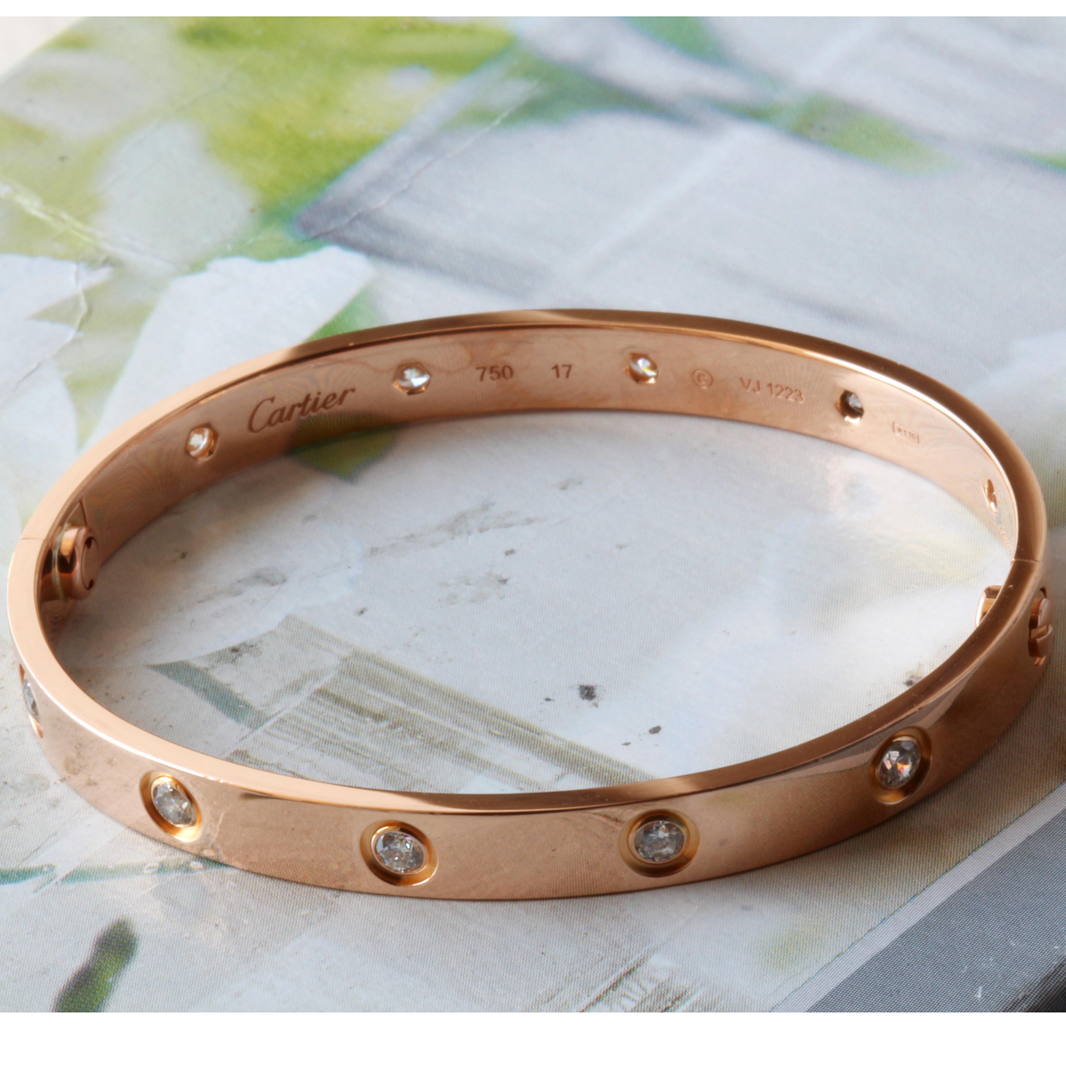 Cartier Love Bracelet Rose Gold With 10 Diamonds Size 17 

New Screw System So the screw cannot fall out.

This Bracelet is in Mint condition.

Comes With Box and Screw Driver

Guaranteed Authentic Cartier
