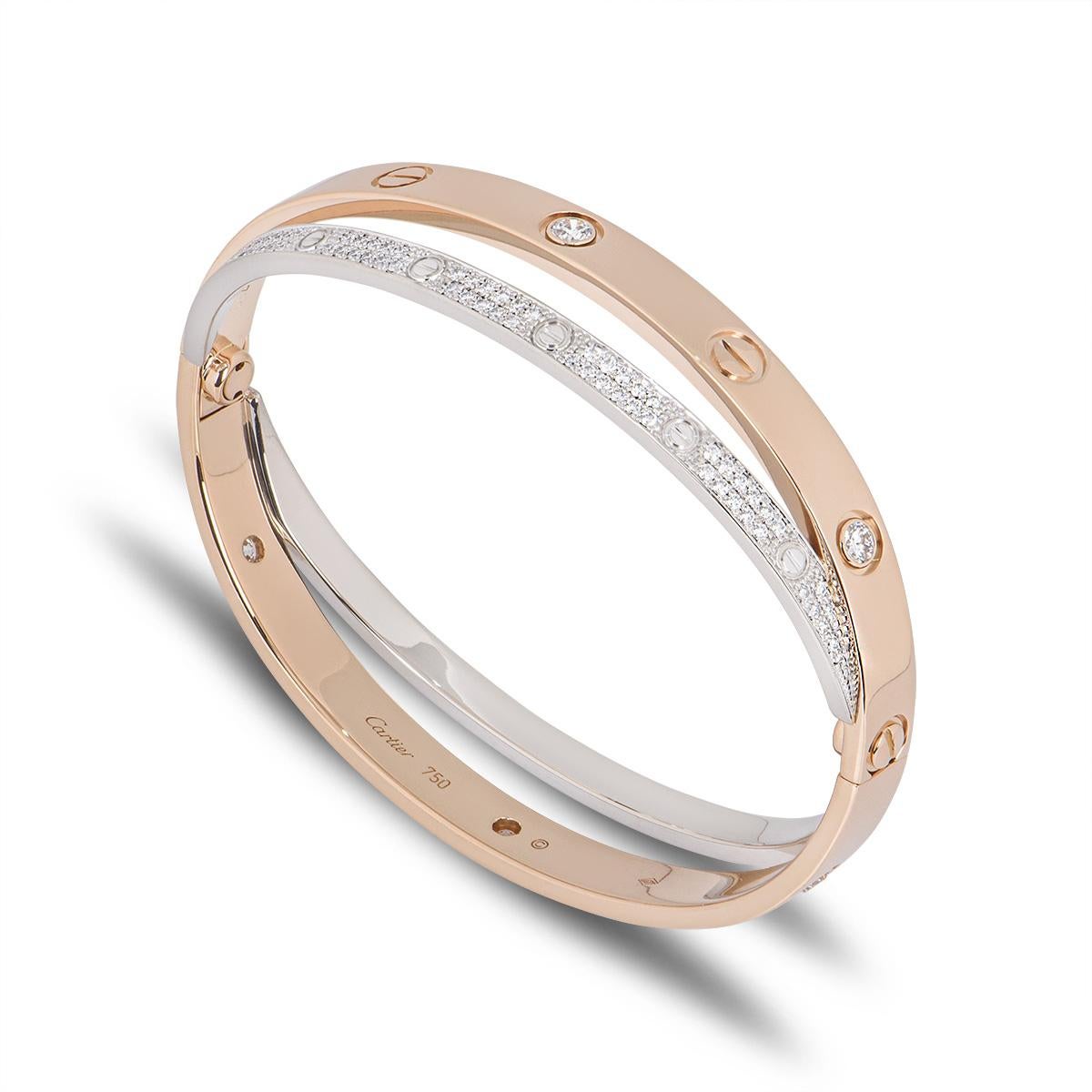 A stunning double Cartier 18k rose and white gold diamond by Cartier from the Love collection. The rose gold bangle is set with 6 round brilliant cut diamonds and alternating screw motifs. Interlinked is a fully diamond paved white gold band on