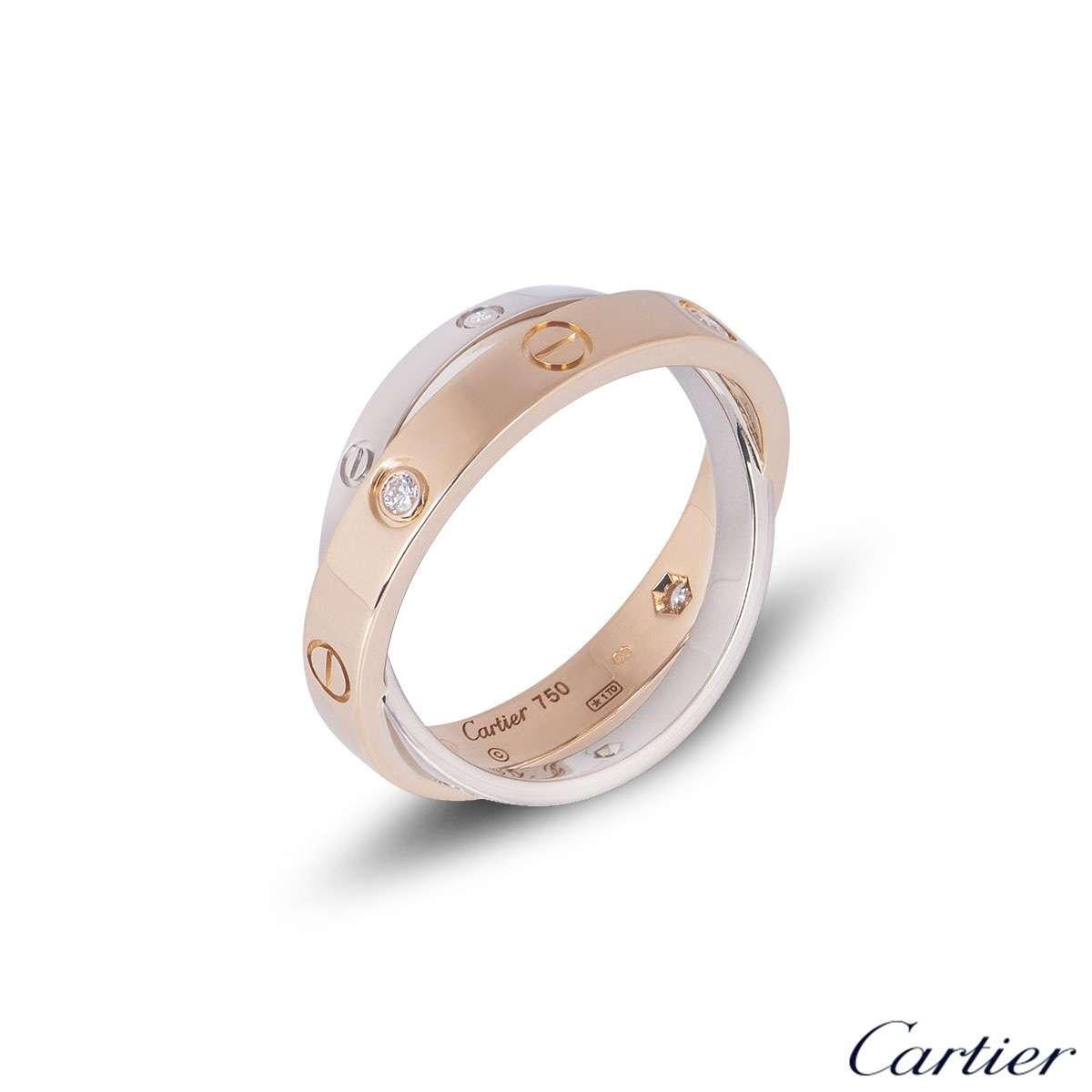 A stylish 18k white and rose gold Cartier double ring from the Love collection. The predominant rose gold ring is set with 6 round brilliant cut diamonds and alternating screw motifs. Interlinking is an 18k white gold band on either side also