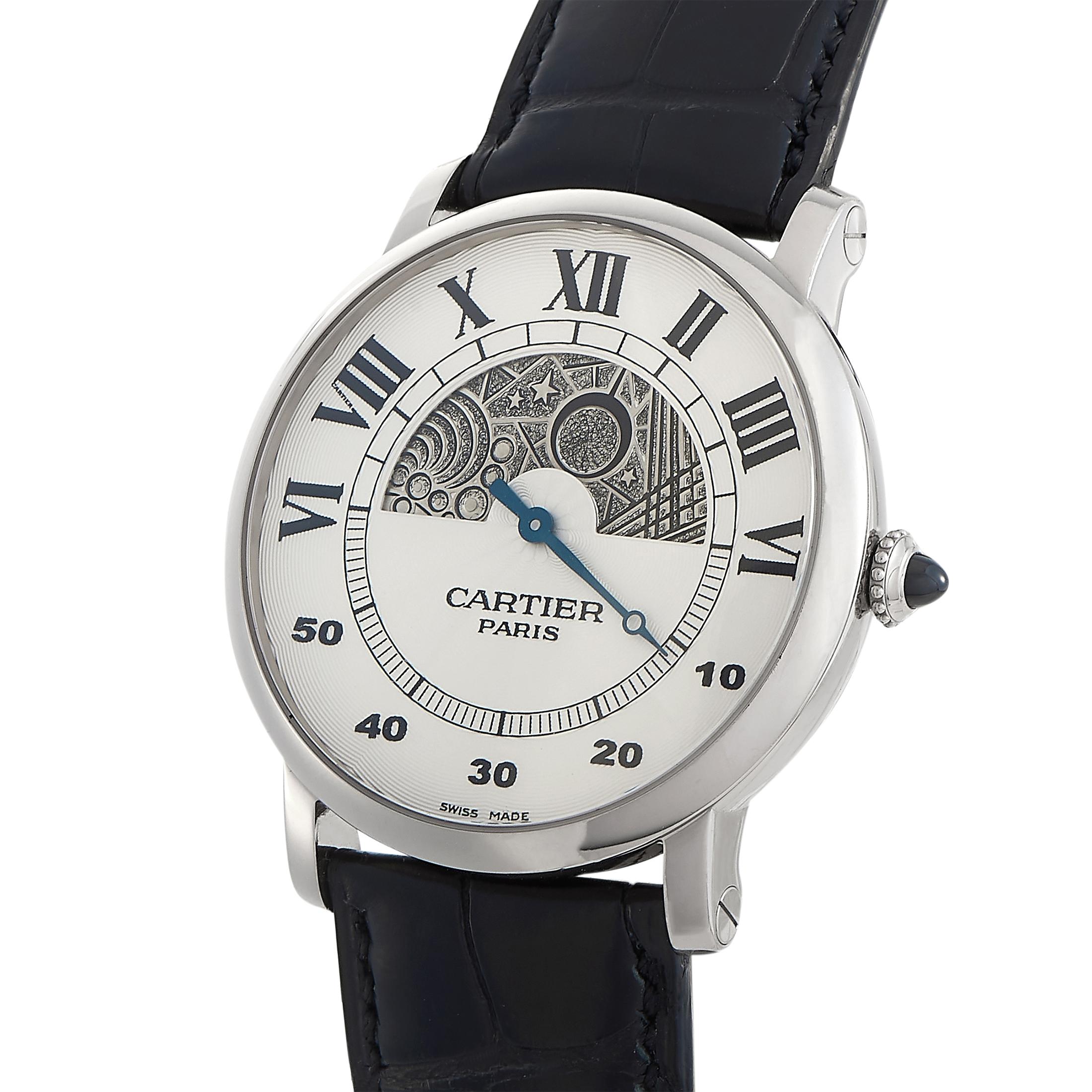 This is the Rotonde de Cartier Day and Night watch, reference number W1550151.
 
 It is presented with a water-resistant 18K white gold case that boasts see-through back. The case measures 42 mm in diameter and is mounted onto a black leather