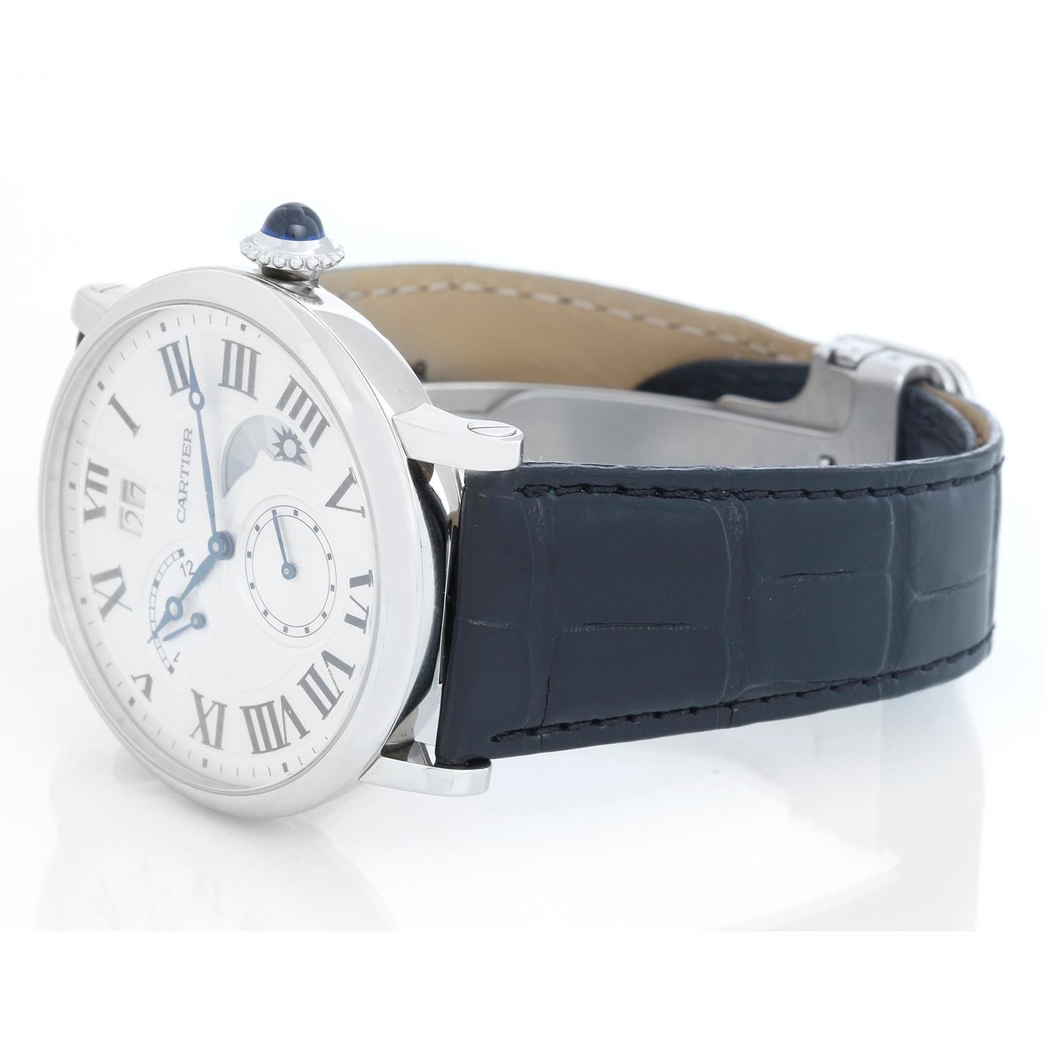 Cartier Rotonde Retrograde GMT Time Zone Watch W1556368 - Automatic self-winding movement. GMT Time Zone, Retrograde.. Stainless steel case ( 40 mm ). Silver guilloche dial with black roman numerals. Blued steel hands. Secret Cartier signature at