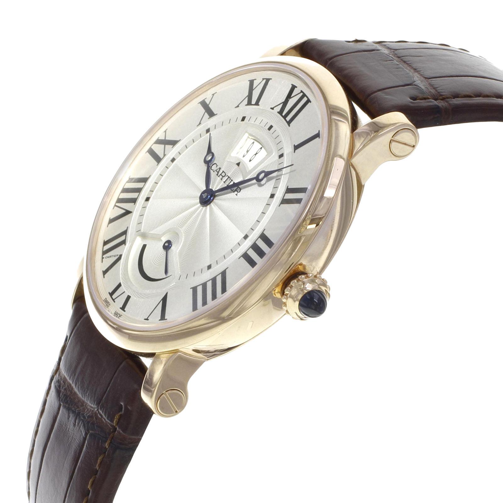 This  Cartier Rotonde  W1556252 is a beautiful men's timepiece that is powered by a mechanical movement which is cased in a rose gold case. It has a round shape face, date, power reserve indicator dial and has hand roman numerals style markers. It