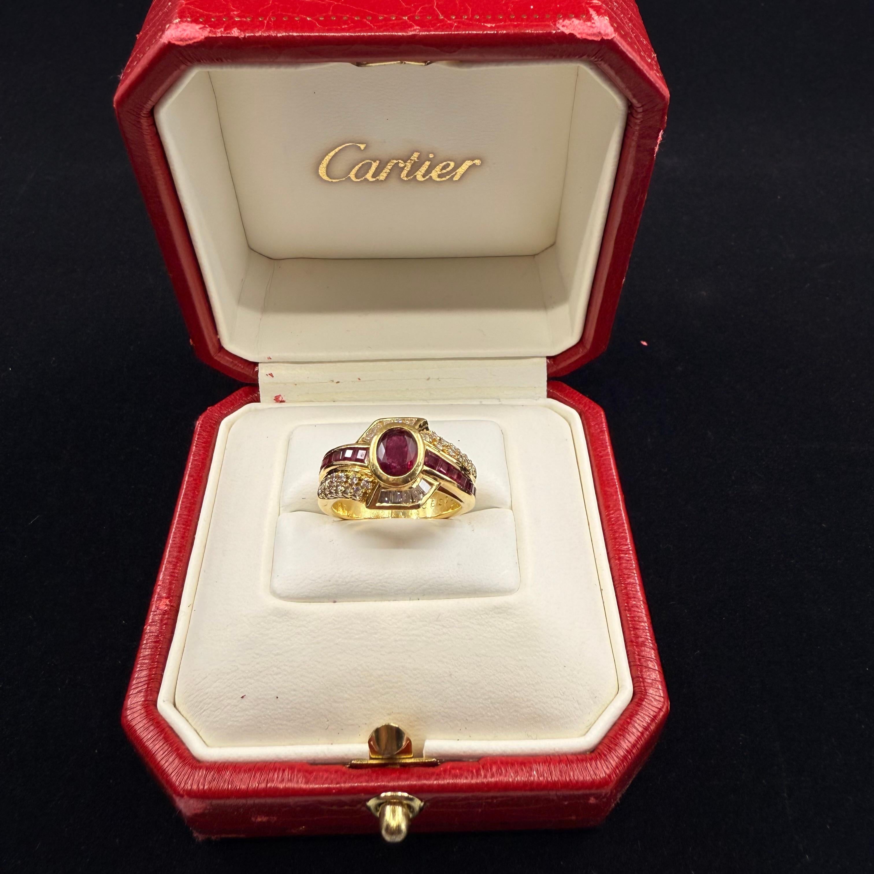 Vintage 1980's 
CARTIER
Ruby and Diamond Cocktail Ring,
18kt Yellow Gold 
Oval Ruby  1.50 cts 
Pretty Red Color 
RUBY Measurement: 6.25mm x 4.75mm 
Round Diamonds Pave Set 
Diamond Round  .75 cts 
Tapered baguette .20 cts
14 Sq Cut Red Ruby accent