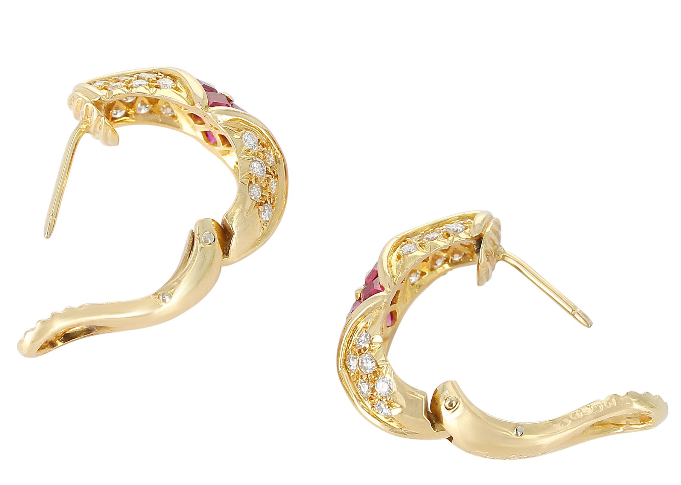 A pair of exquisite Cartier Ruby and Diamond Earrings, with 1.75 carats of square-cut Rubies and 1.10 carats of round Diamonds. 18 Karat Yellow Gold. Length: 2 CM.