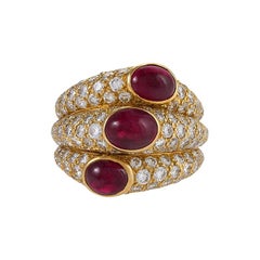 Anello Cartier con rubino e diamante "a tre bande