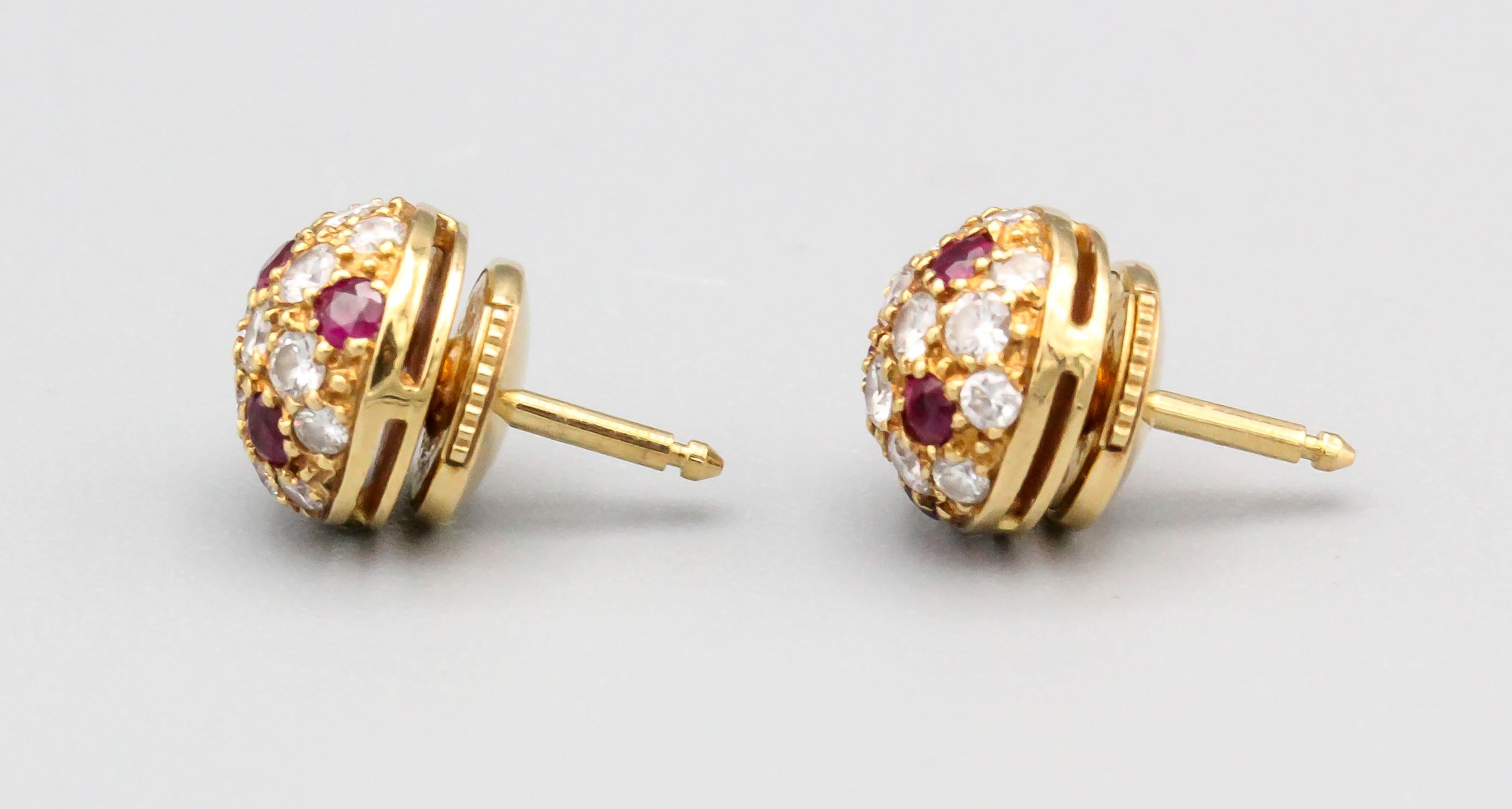 Fine pair of ruby, diamond and 18K yellow gold stud earrings by Cartier. They feature rich red rubies, along with high grade round brilliant cut diamonds on an 18K yellow gold setting. Impeccable workmanship and easy to wear.

Hallmarks: Cartier,