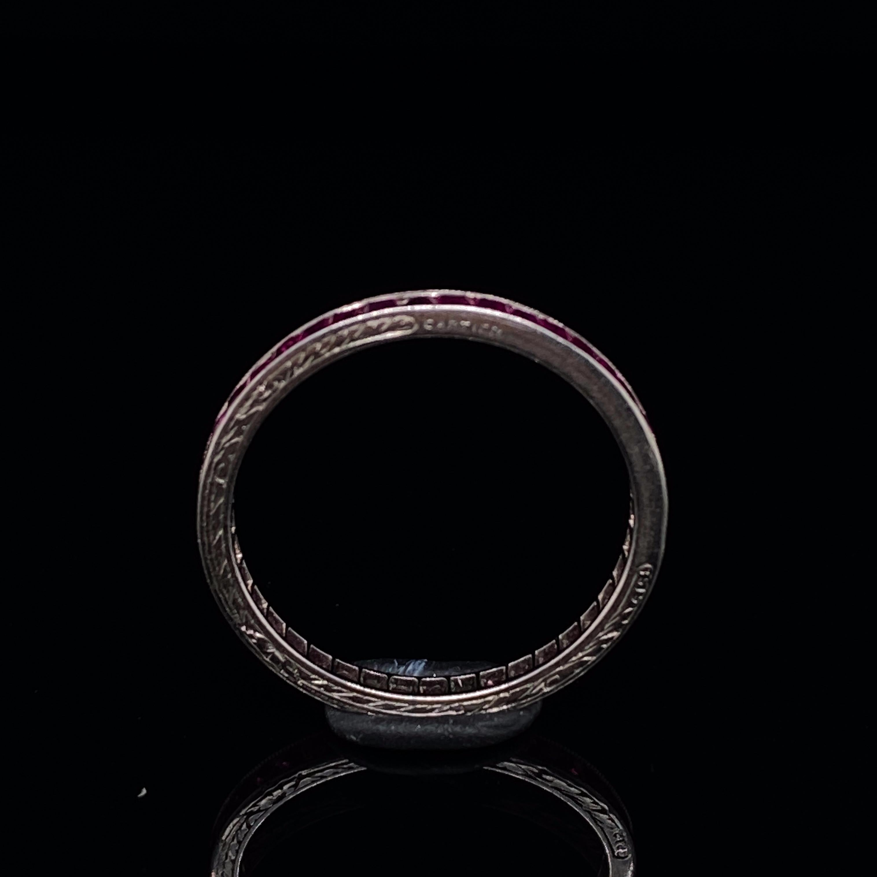 A Cartier ruby full eternity ring in Platinum

This fantastically handcrafted retro Cartier ring is full set with step cut rubies between two fine engraved bands of platinum.

The stones are bright, lively pink in hue exactly the high quality that