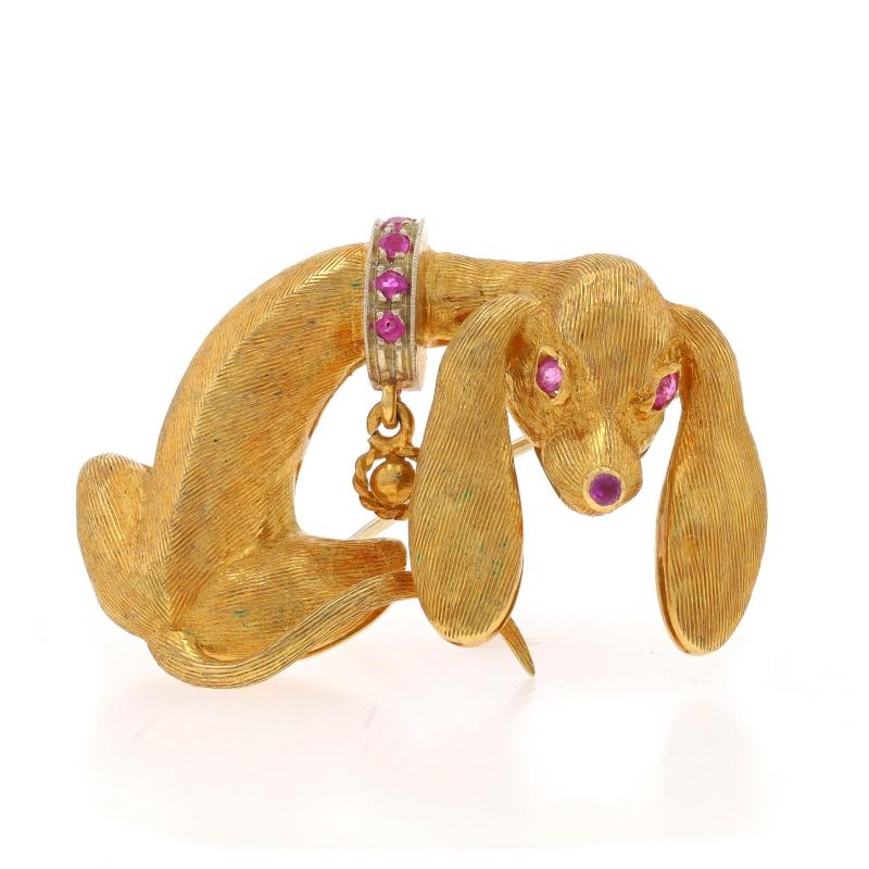 Brand: Cartier
Era: Vintage

Metal Content: 18k Yellow Gold & 18k White Gold

Stone Information
Natural Rubies
Treatment: Heating
Cut: Round
Color: Pinkish Red

Style: Brooch
Fastening Type: Hinged Pin and Trombone Clasp
Theme: Dachshund Dog, Pet