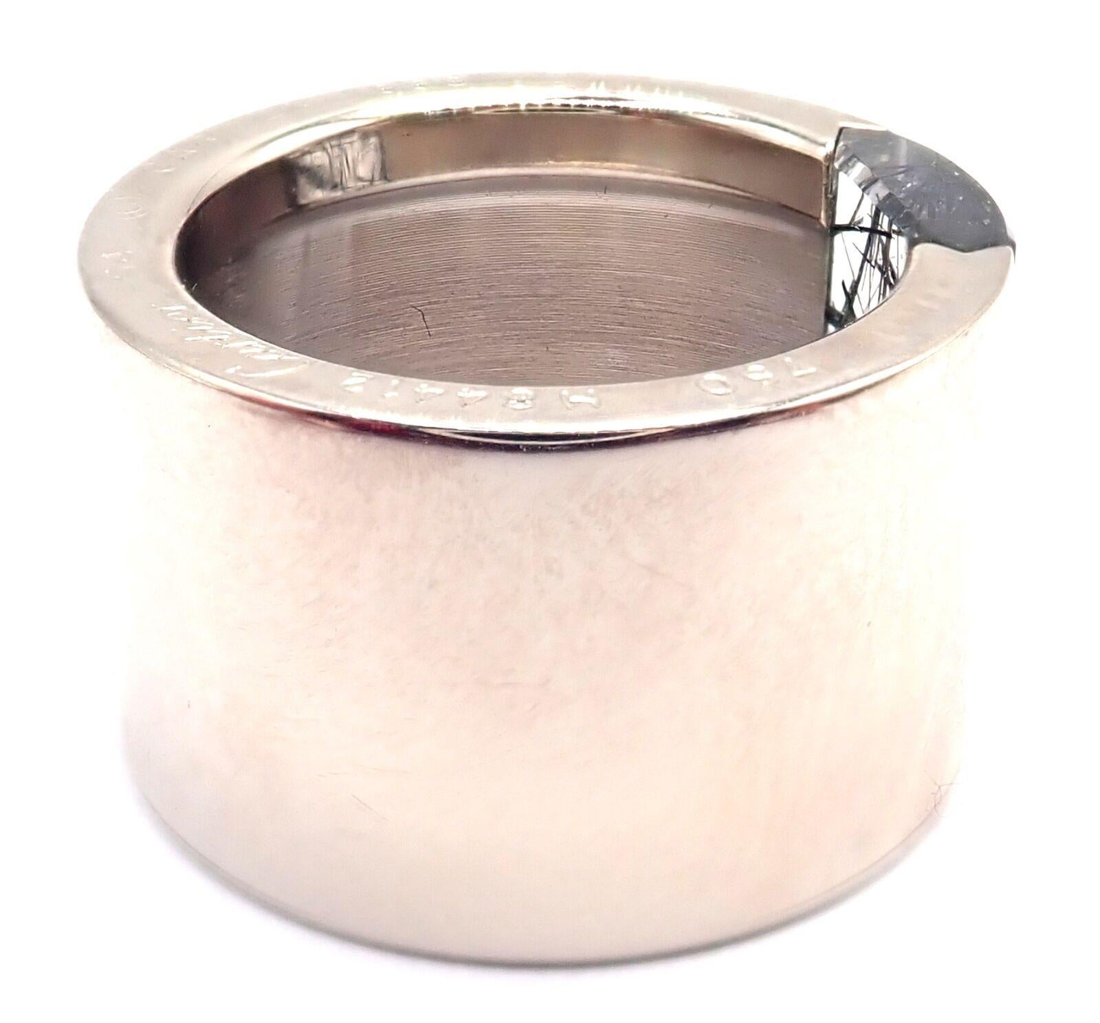 18k White Gold Rutilated Quartz Wide Band Ring by Cartier. 
With 1 x Rutilated Quartz 
Details: 
Ring Size: 6.75 US, Europe 54
Width: 14mm 
Weight: 18.9 grams
Stamped Hallmarks: Cartier 750 54 1999 H84XXX(serial number omitted)
*Free Shipping within