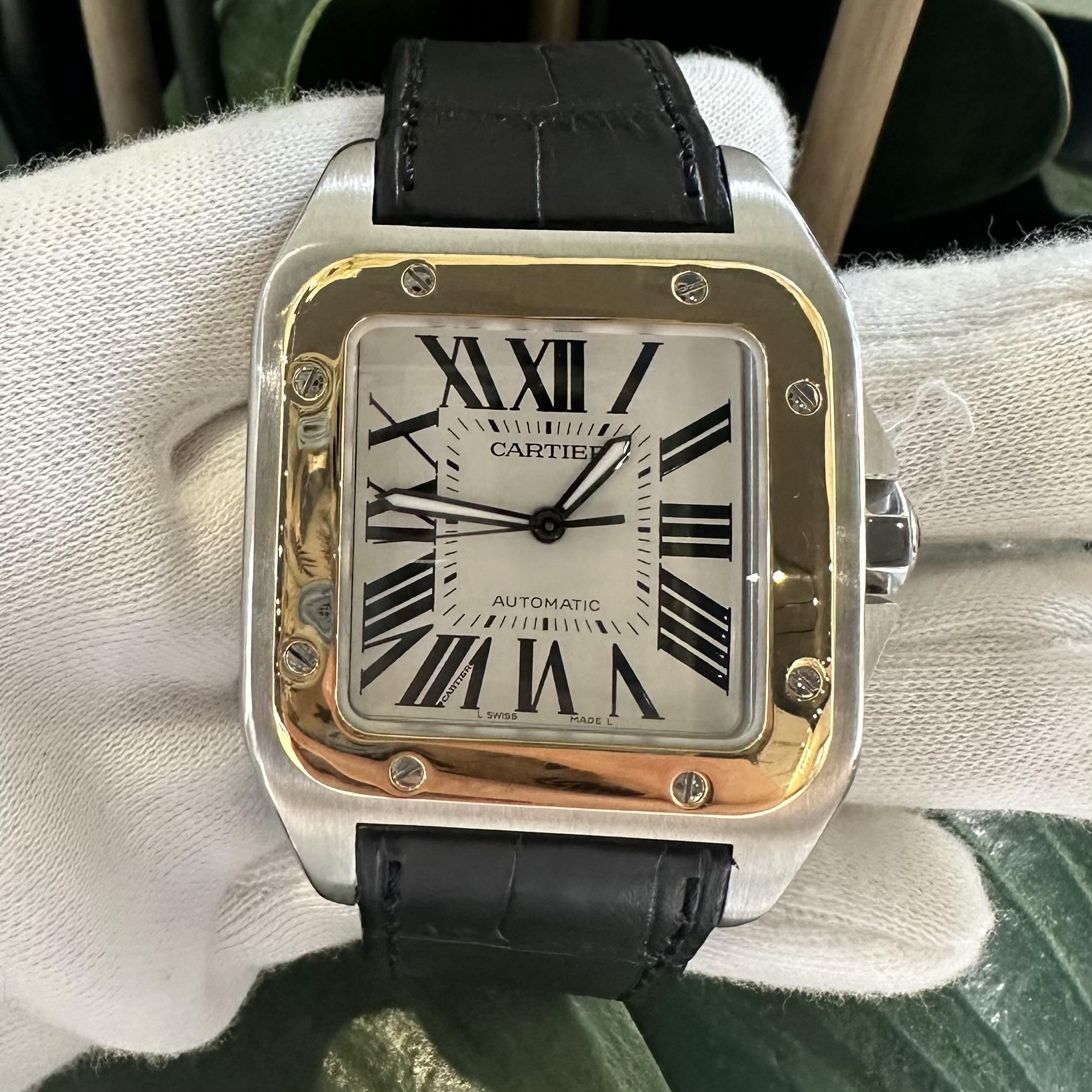 Brand: Cartier​​​​​​​
Model Name: Santos 100
Model Number: 2656
Movement: Automatic
Case Size: 38 mm
Dial Color:  White
Metal: Stainless Steel / 18k Yellow Gold
Hour Markers: Roman Numerals
Crystal: Sapphire Crystal
Bracelet: Leather
​​​​​​​Water