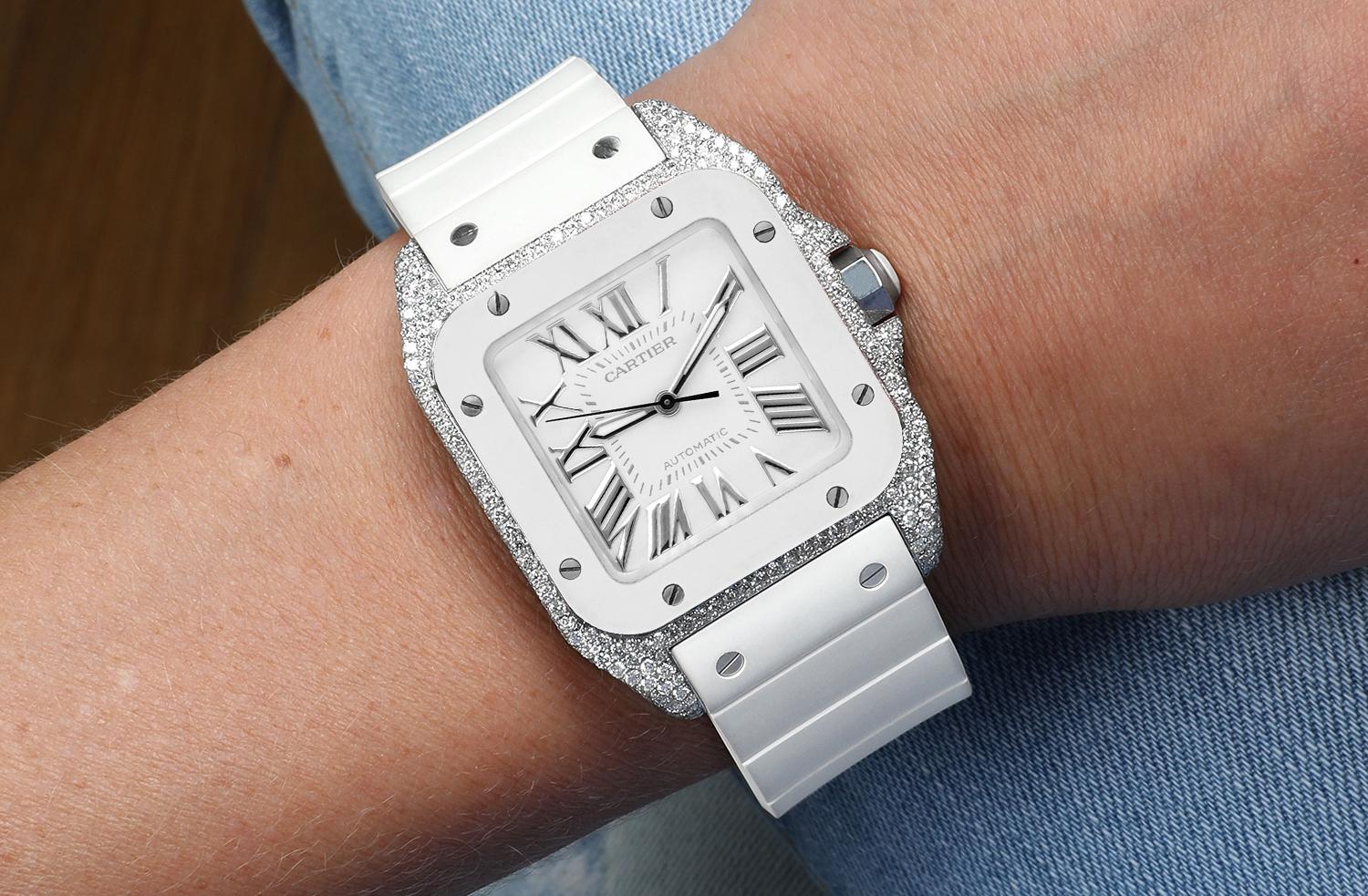 Brand: Cartier
Series: Santos 
Model: 2878
Case Diameter: 33 mm
Bracelet: Strap
Bezel: Custom diamond set
Dial: White Dial
The sale includes a original box and an appraisal certificate which states the watch's credentials
Attached to the appraisal