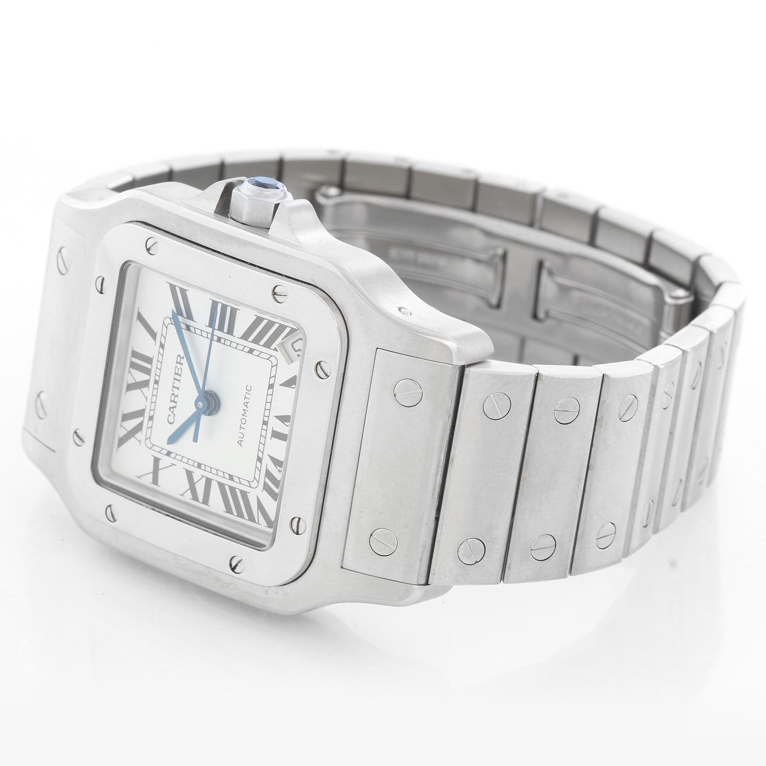 Cartier Santos 100 Steel Automatic Men's Watch W20098D6 - Automatic winding. Stainless steel case (34mm x 45mm). Silver dial with black Roman numerals and date at 5 o'clock. Stainless steel Cartier deployant style bracelet; fits a 6 inch wrist but