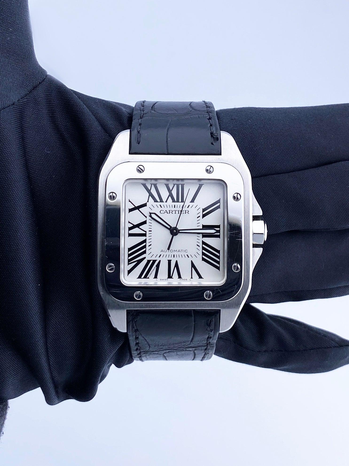 Cartier Santos-100 W20073X8 Mens Watch. 38mm stainless steel case with stainless steel fixed bezel. White dial with black steel luminous hands and black Roman numeral hour markers. Minute markers on the inner dial. Will fit up to a 7-inch wrist.