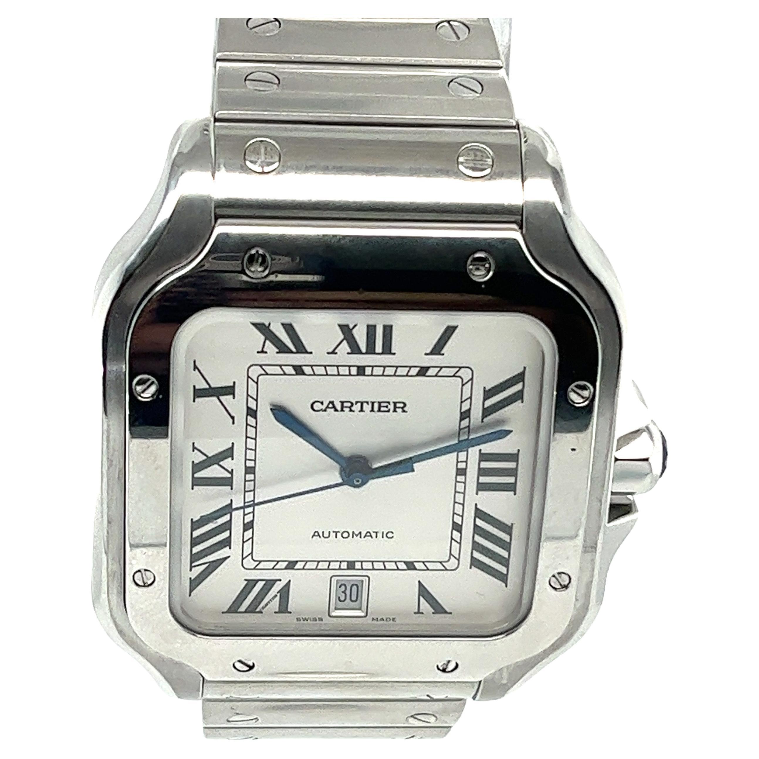 This pre-owned Cartier Santos in stainless steel features silver opaline dial with Roman numerals and date at 6 o’clock. Crafted with  Cartier stainless steel bracelet and has a  deploying buckle. Fits up to 7-1/2 inch wrist. Has a large face with