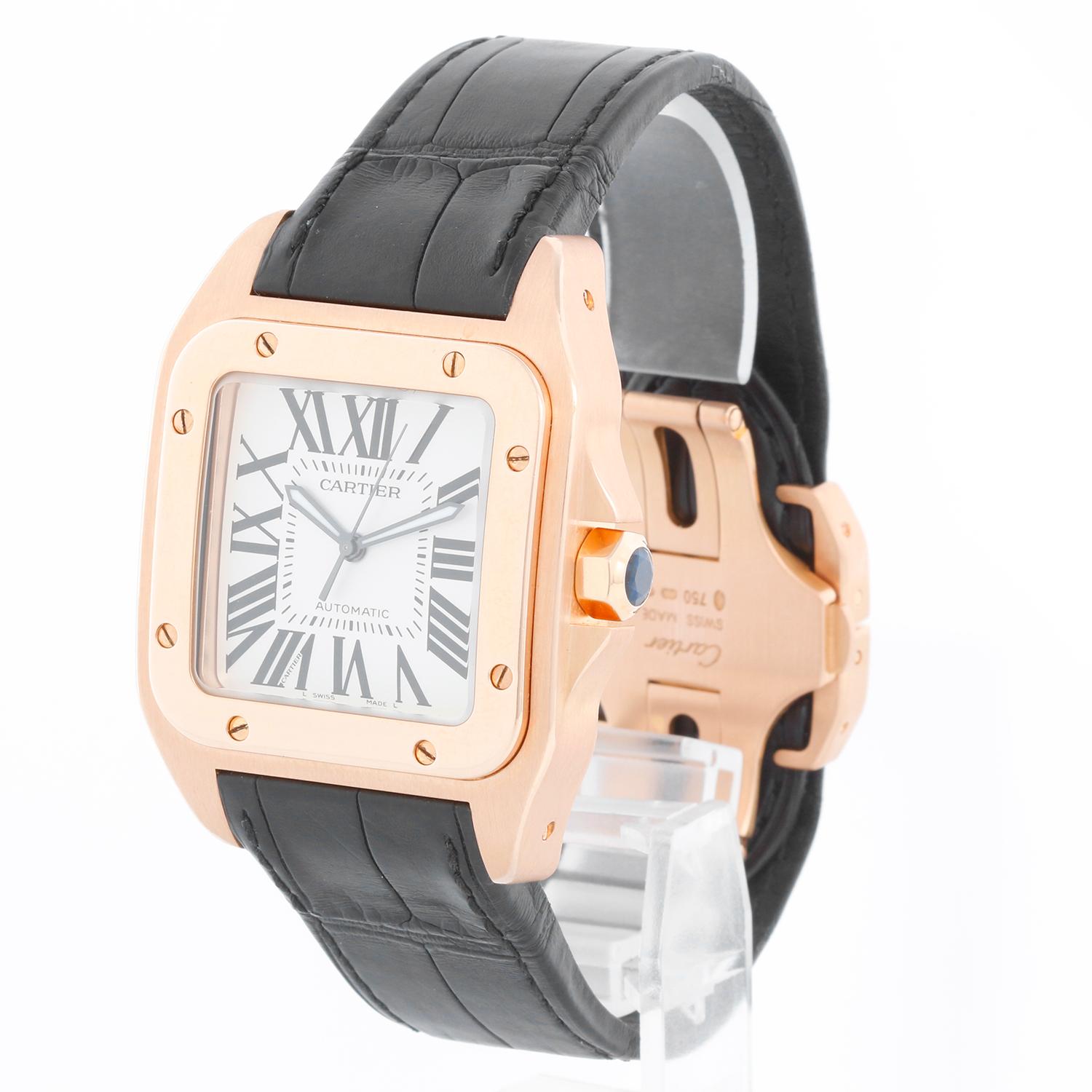 Cartier Santos 100 XL 18K Rose Gold Men's Watch 2792 W20095Y1- Automatic winding. 18K Rose Gold (41mm x 50mm). Silver dial with roman numerals. Black Cartier strap with 18K Rose gold deployant clasp. Pre-owned with Cartier box.