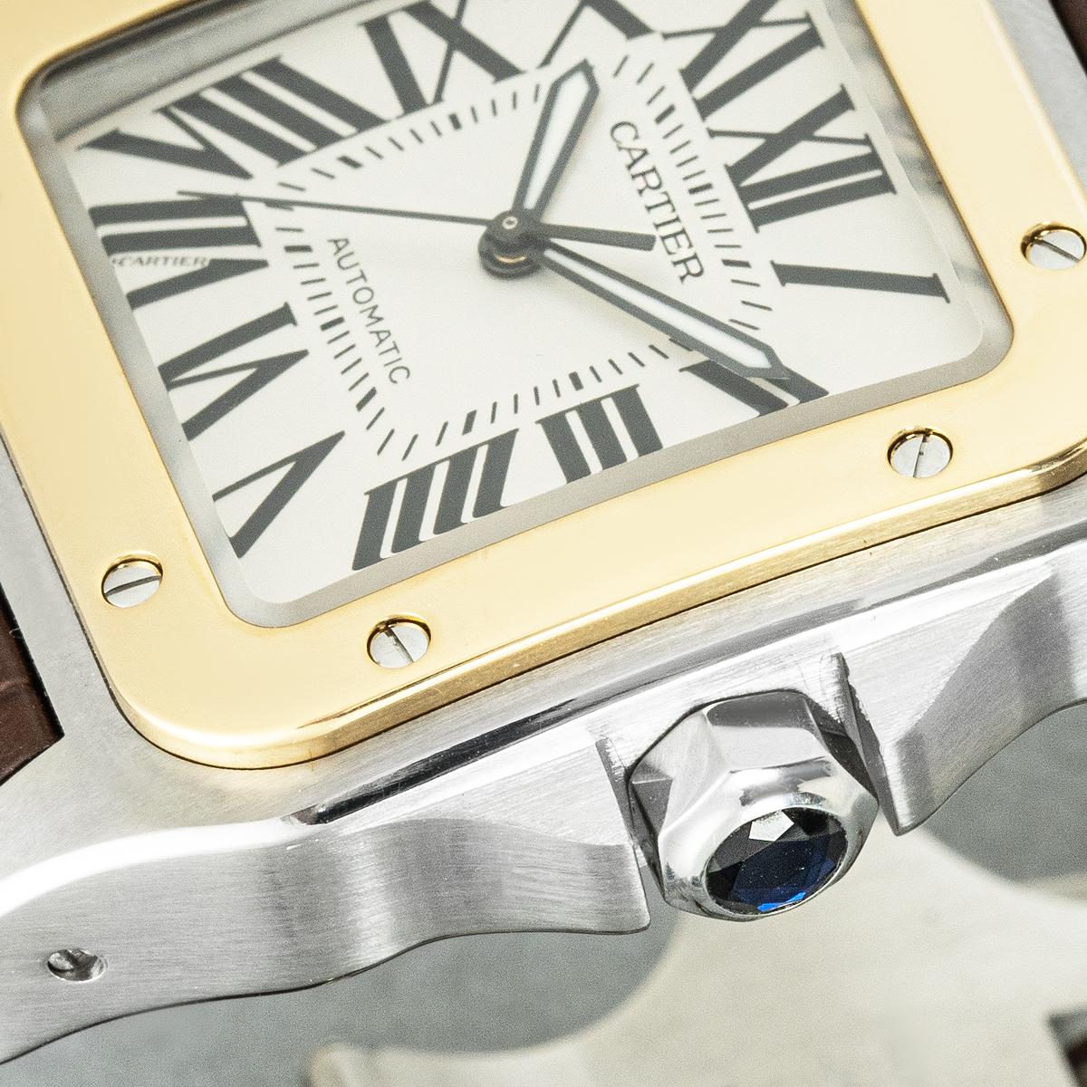 Montre-bracelet Santos XL de 38 mm en or jaune et acier inoxydable. Cadran argenté avec chiffres romains et signature cachée de Cartier à 