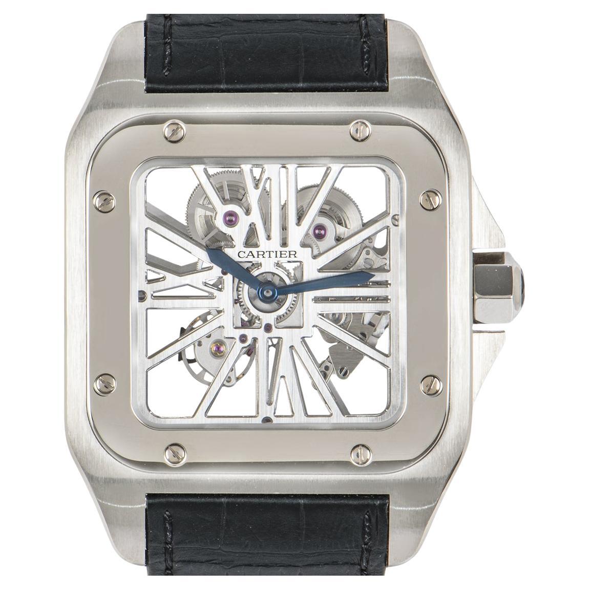 A unique Santos 100XL open skeleton wristwatch crafted in palladium by Cartier. Featuring a stunning skeleton dial that gives you a closer look at the mechanical function of this timepiece. Which can be further admired from the see-through case