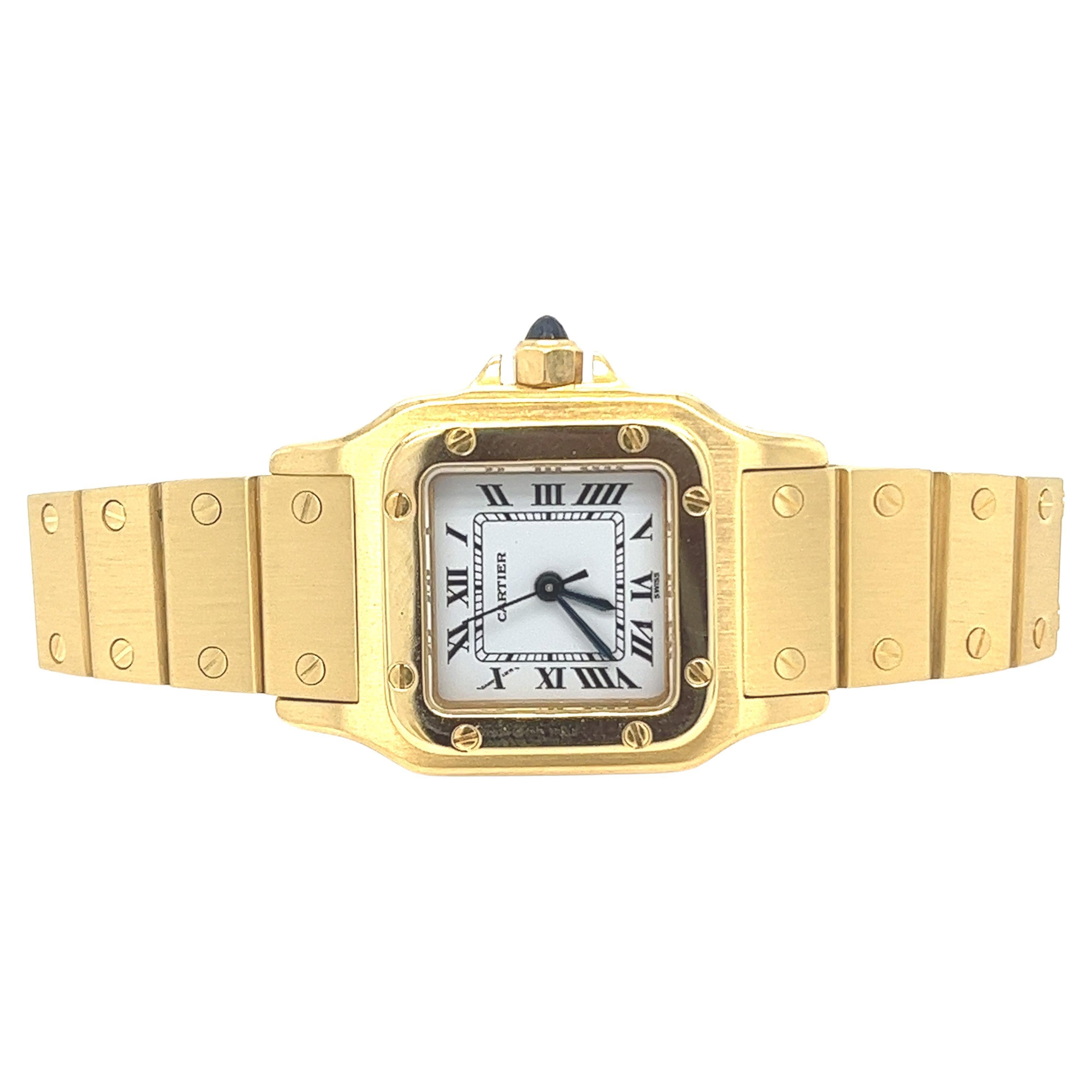 Timeless classic Cartier Santos 18 karat yellow gold automatic wrist watch for ladies.
Automatic movement wrist watch, 18 karat yellow gold case of circa 2.4 cm / 0.94 in width. White dial with black Roman numerals. Graduated Santos bracelet in 18