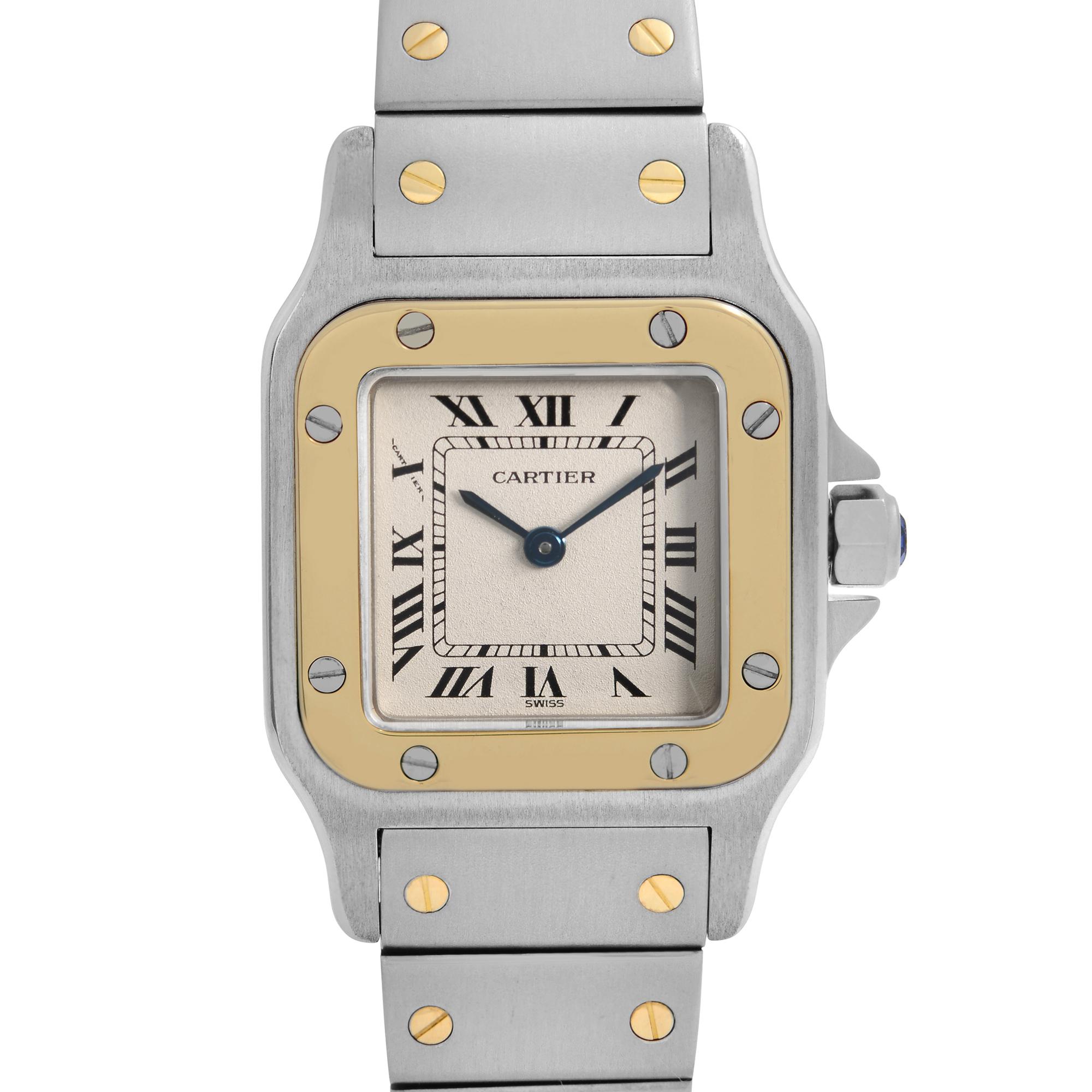 Pre-owned Cartier Santos 24mm Steel 18k Gold Beige Dial Women's Quartz Watch W20012C4. Dial have black stains due to age. case reference 1057930.  This Beautiful Timepiece is Powered by Quartz (Battery) Movement And Features: Stainless Steel Case