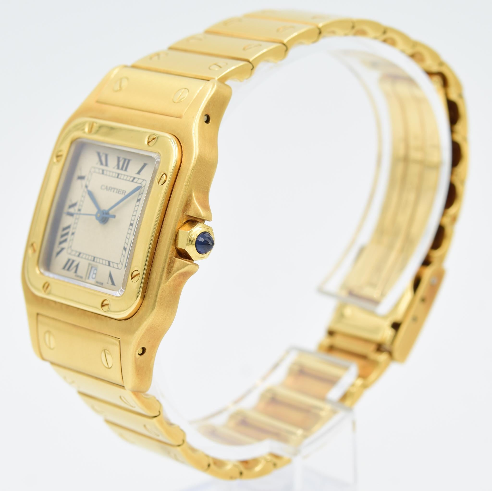 This Cartier Santos 887901 was recently traded in to our store and is in very good condition. This model has a quartz movement. The watch is in a 29mm 18k yellow gold case on a bracelet. The dial is silver with the signature blue hands.
