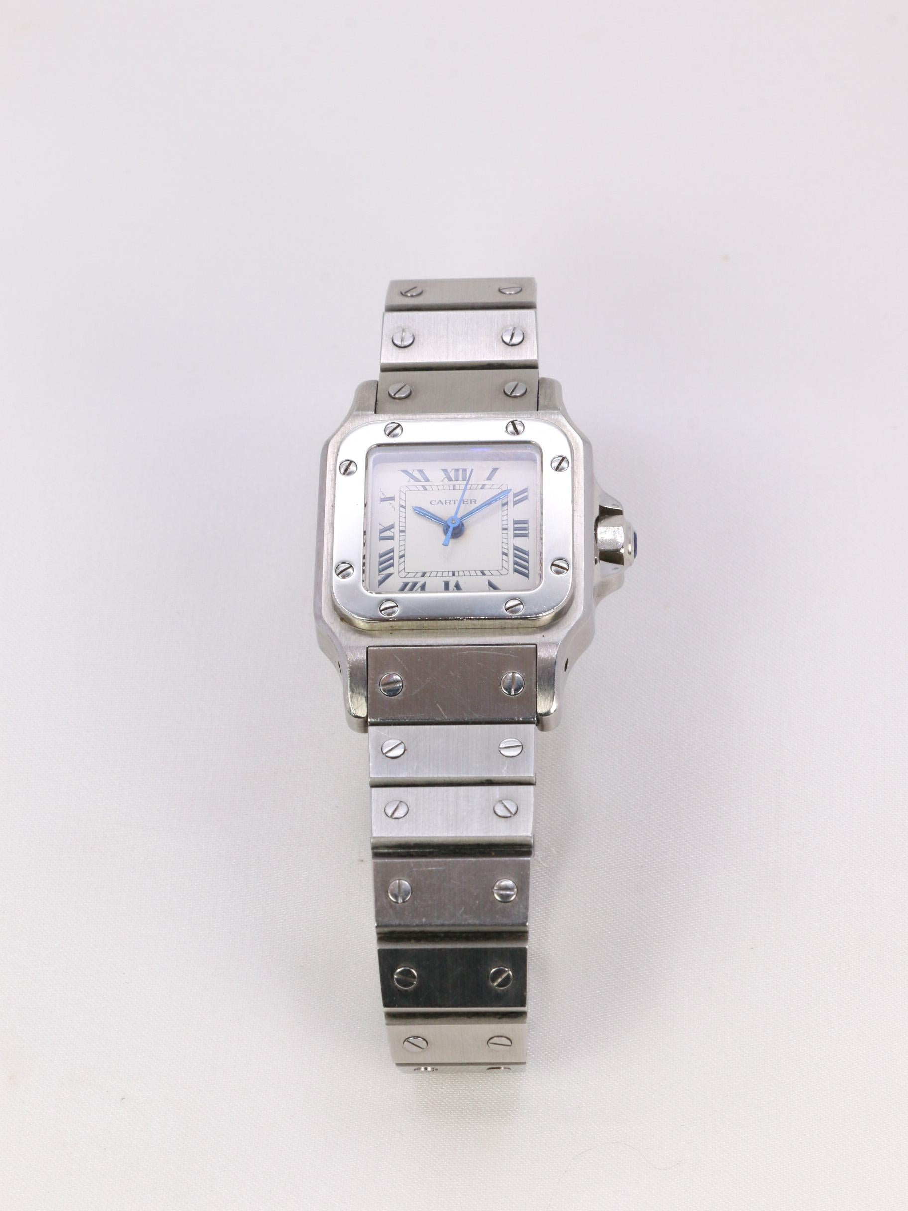 Cartier watch, Santos automatic model in steel. 
Dial with Roman numerals 23 x 21 mm, square stainless steel case, screwed steel caseback and bezel, sword hands, adjustable link bracelet, ETA 2670 automatic movement. 
Vintage watch from the