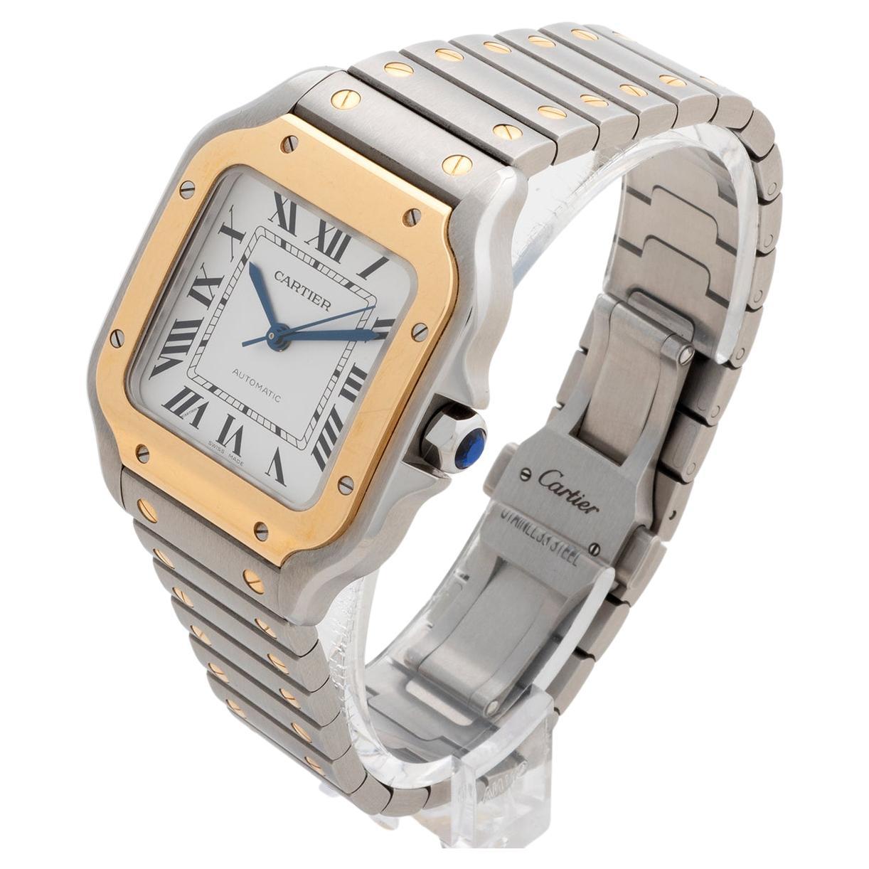 Unsere Cartier Santos Automatik in 18k Gelbgold und Edelstahl ist die neueste Version, Referenz W2SA0016 mit 35mm Gehäuse und verfügt über das Schnellverschlussarmband, das ein einfaches Anlegen an Leder ermöglicht. Dieses Exemplar ist in