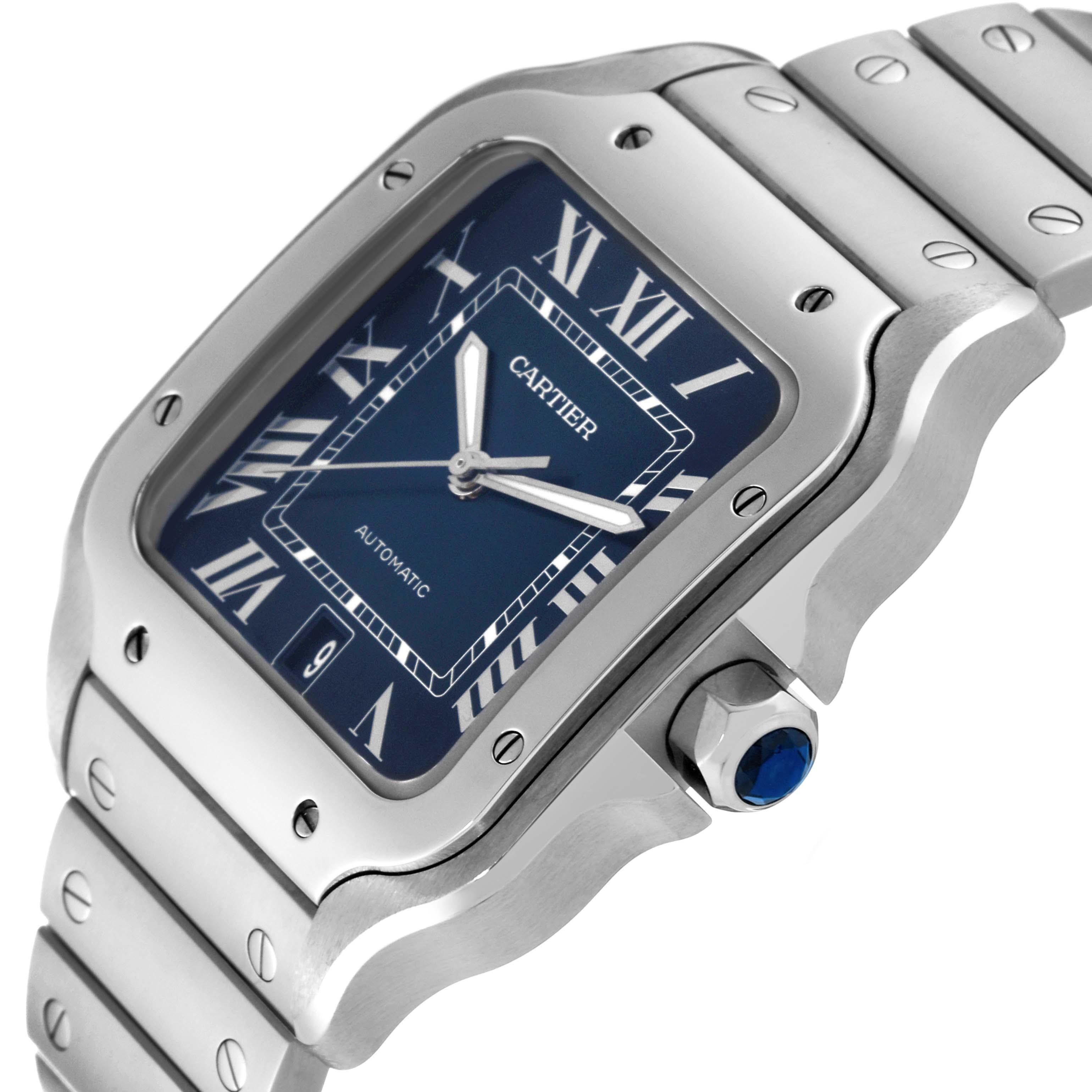 Cartier Santos Blue Dial Steel Mens Watch WSSA0030 Box Card. Automatic self-winding movement. Stainless steel case 39.8 x 47.5 mm. Protected octagonal crown set with a faceted blue spinel. Stainless steel bezel punctuated with 8 signature screws.