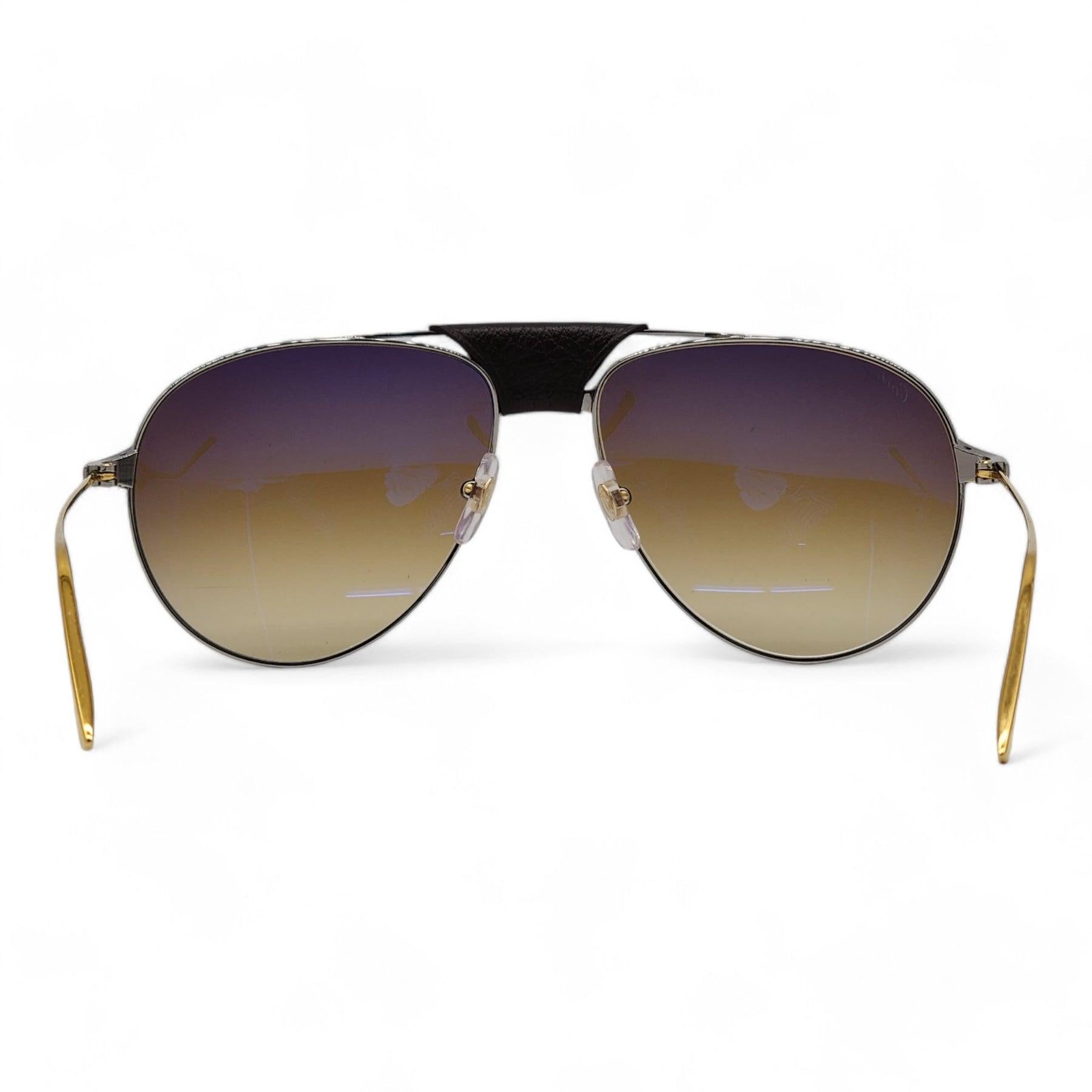 Cartier Santos de Cartier Sunglasses in Gold.

Additional information:
Style: CT0038S 008
Color: Gold
Country: France
Dimension: Size: 61-16-135
Condition: Brand new with case.
