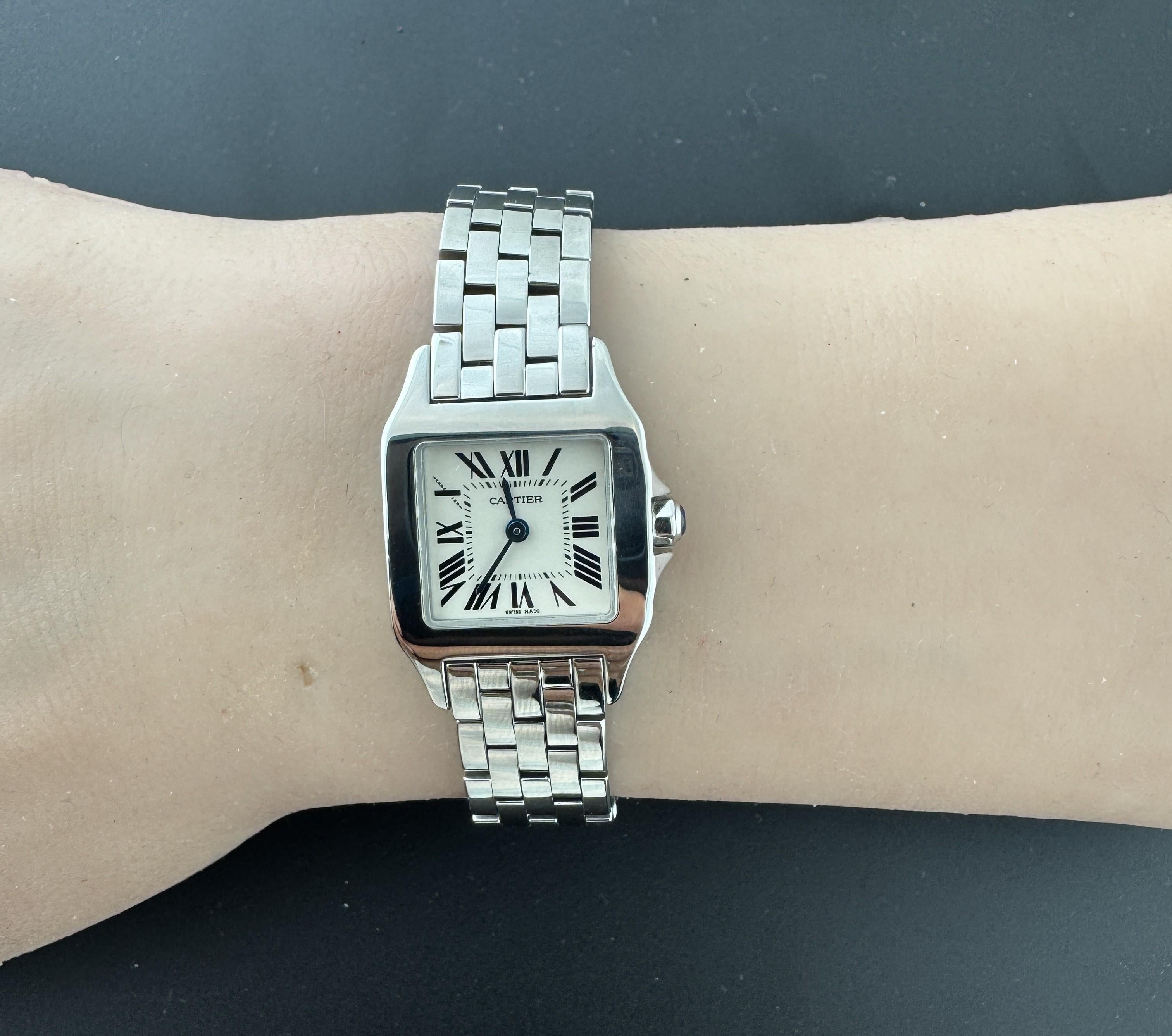 Cartier Santos Demoiselle Ladies Watch

Model: 2698
Serial: 703848MX

This classic Cartier Santos Demoiselle watch is set in stainless steel.

Off-White Dial with black roman numerals

Quartz movement

20mm x 28mm case

Fits up to 6.5