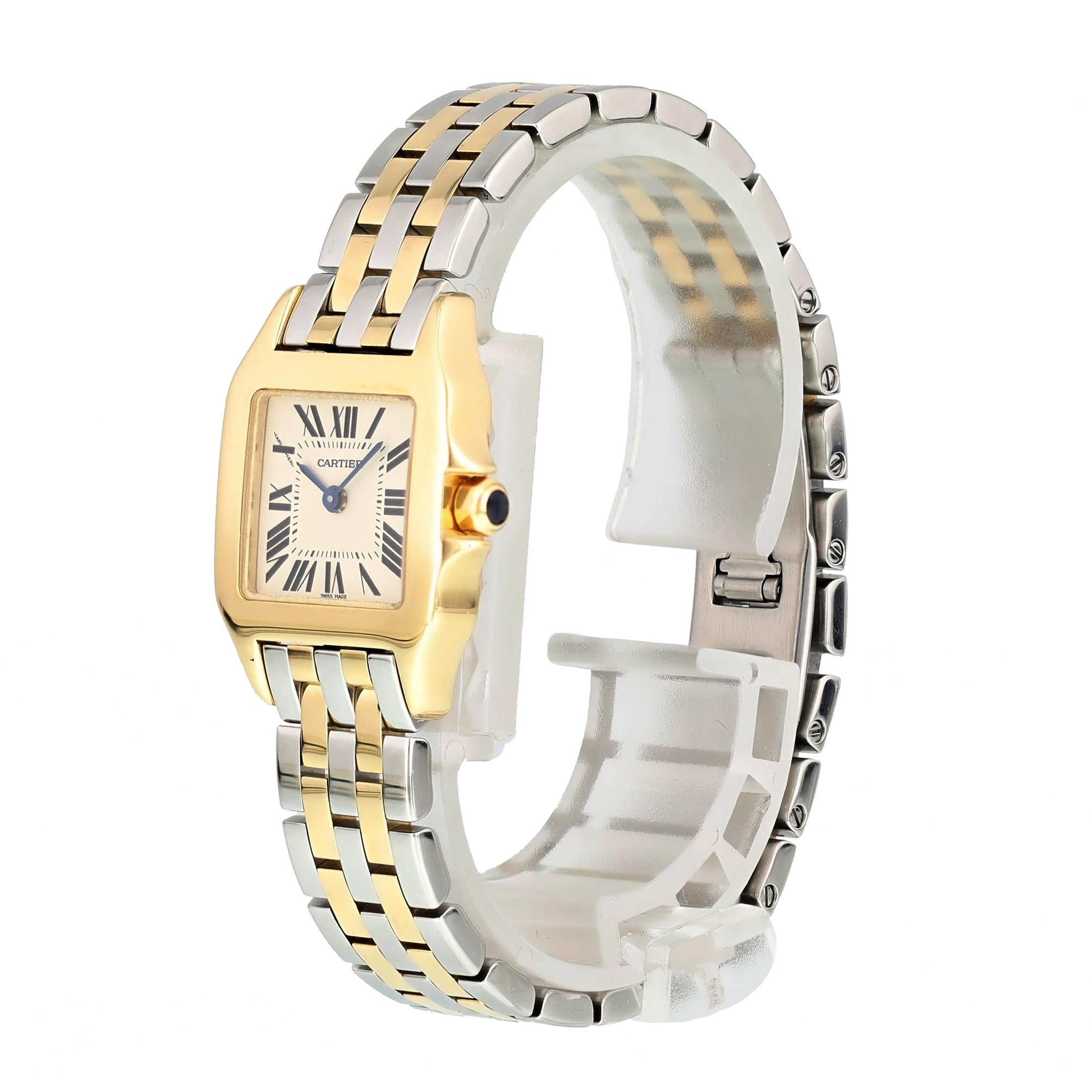 Cartier Santos Demoiselle 2699 Ladies Watch.
20mm 18k Yellow Gold case. 
Yellow Gold Stationary bezel. 
Off-White dial with Blue steel hands and Roman numeral hour markers. 
Minute markers on the inner dial. 
Stainless Steel Two-tone Bracelet with