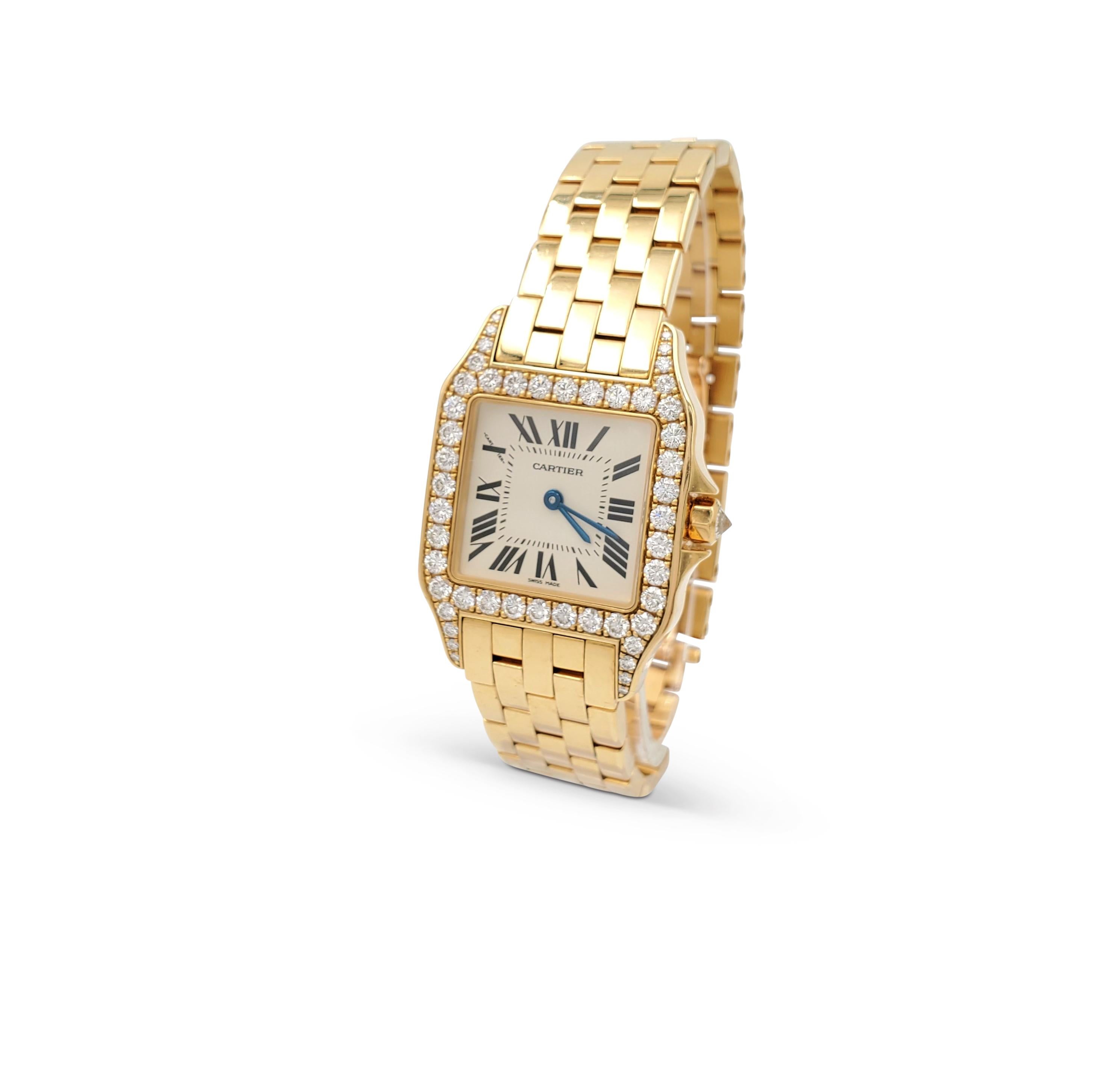 Authentic Cartier Santos Demoiselle watch crafted in 18 karat yellow gold. The octagonal case (37 mm x 26 mm) is set with an estimated 1.30 carats of high-quality round brilliant cut diamonds. Cream dial with painted black roman numerals and